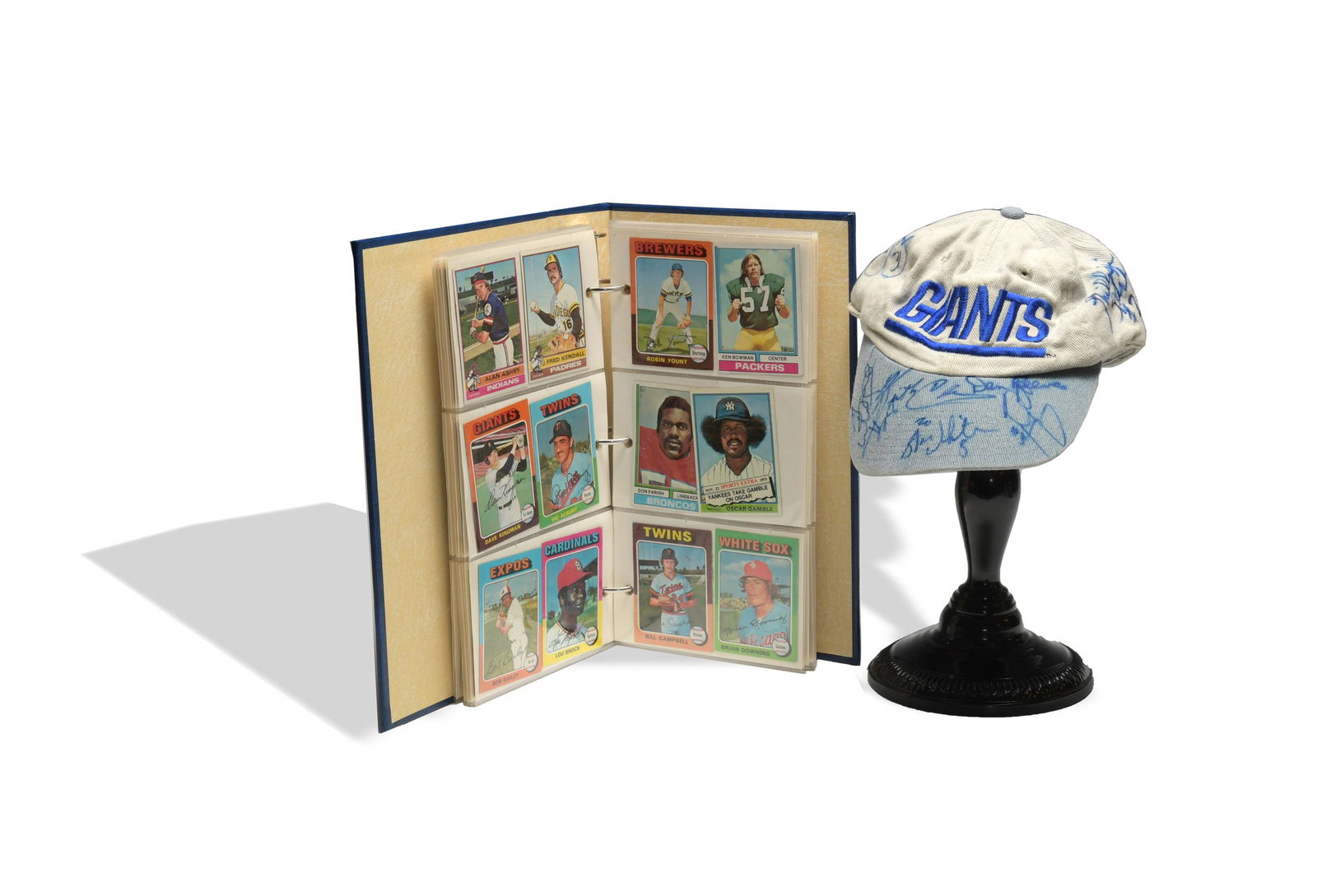 NY Giants Autographed Ball Cap, 70: Giants team cap circa 1995, players include: Stan White, Tyrone Wheatley, Dan Reeves (Coach), Phillippi Sparks, Jason Sehorn, and Michael Brooks. Baseball and Football card album assembled in the earl