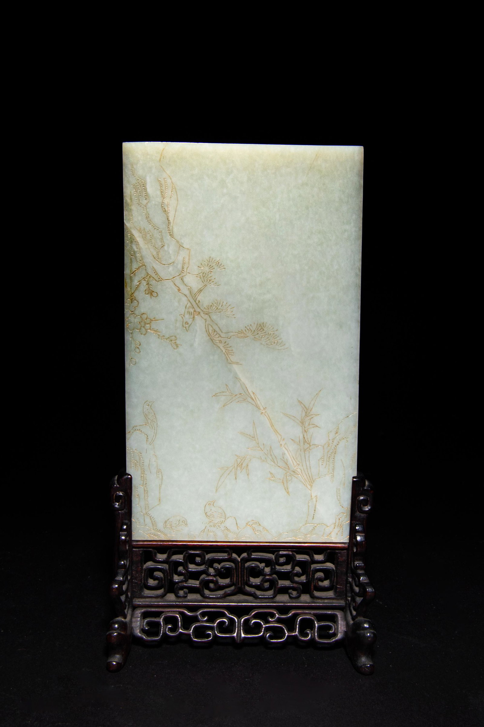 Chinese Carved Jade Table Screen, 19th Century early: A Chinese white jade table screen dating from the 19th century early. The screen is carved on one side with a scene of bamboo, a pine tree, a flowering branch, and rocky outcroppings among which 4 bir