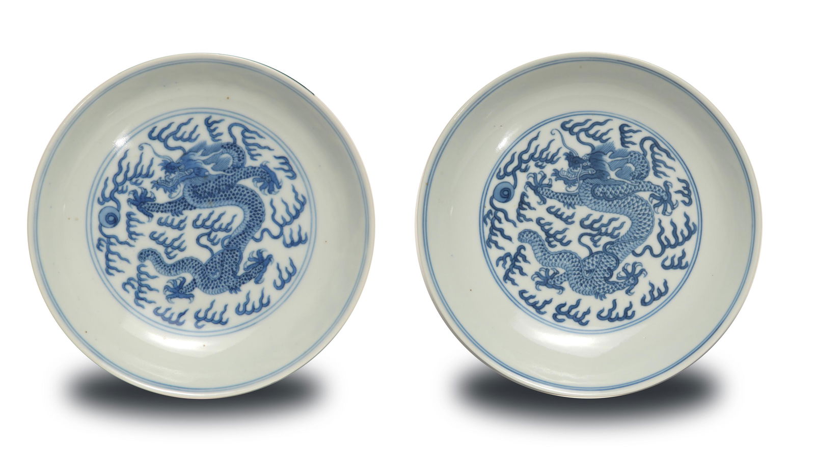 Pair of Imperial Chinese Plates, Daoguang: PLEASE NOTE: This lot's photos have now been corrected. A pair of Imperial Chinese blue and white porcelain dragon plates with 6-character Daoguang marks and of the period. Each plate features a drago