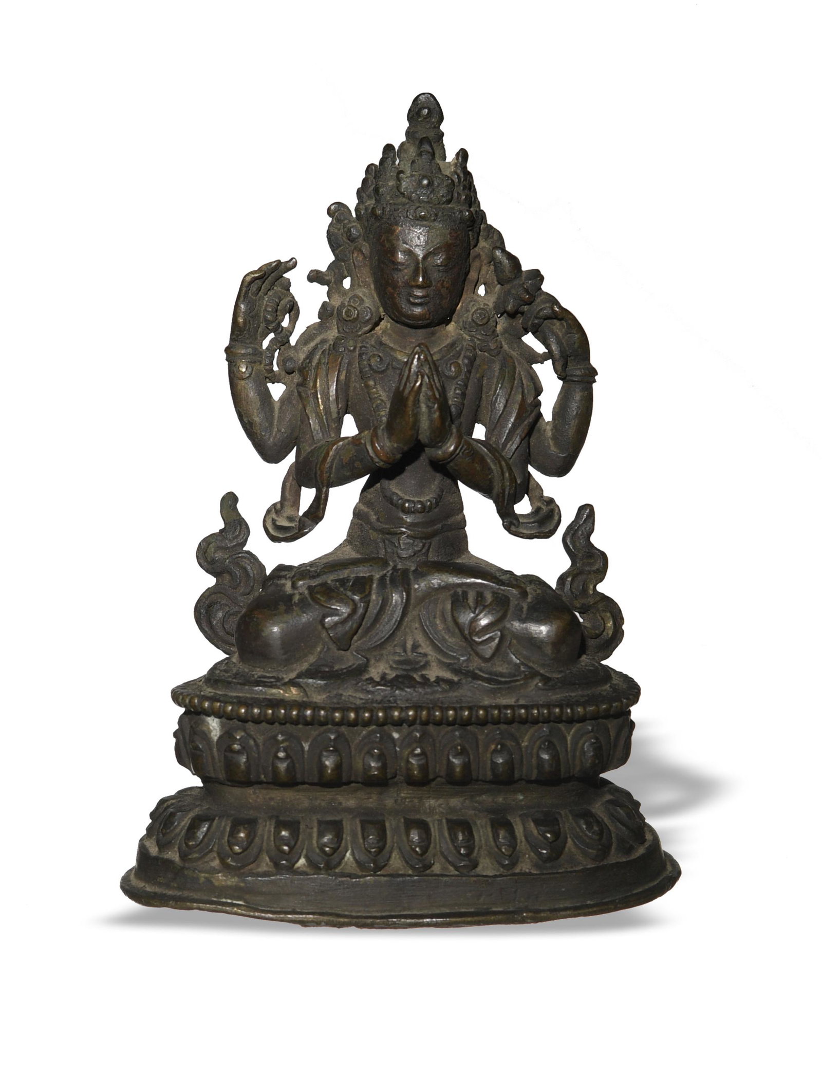 Chinese Bronze Buddha, Ming or Earlier: A Chinese bronze statuette of Buddha seated in the lotus position dating from the Ming dynasty or earlier. The Buddha sits on a double lotus pedestal and holds a string of prayer beads in his hands. D