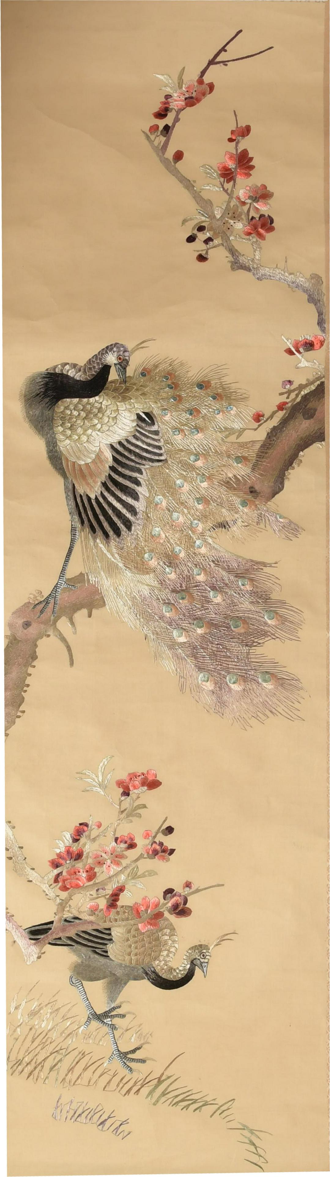 Chinese Embroidery of Peacocks: A Chinese embroidery on silk of a pair of peacocks with a flowering branch. It is mounted on a silk backing with dowels. Dimensions are: 50 inches tall X 14 inches wide, 127 cm X 35.6 cm. All measurem