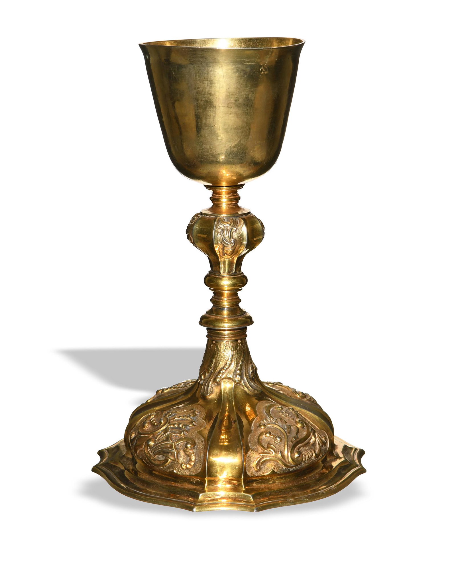 German Gilt Silver Chalice, dated 1748: Gilt silver chalice with repousse metalwork, Maltese cross engraving, and Latin engraving and date on the bottom. Maker's marks on the base rim with Norden City mark. Dimensions: 9 3/8 inches tall X 6