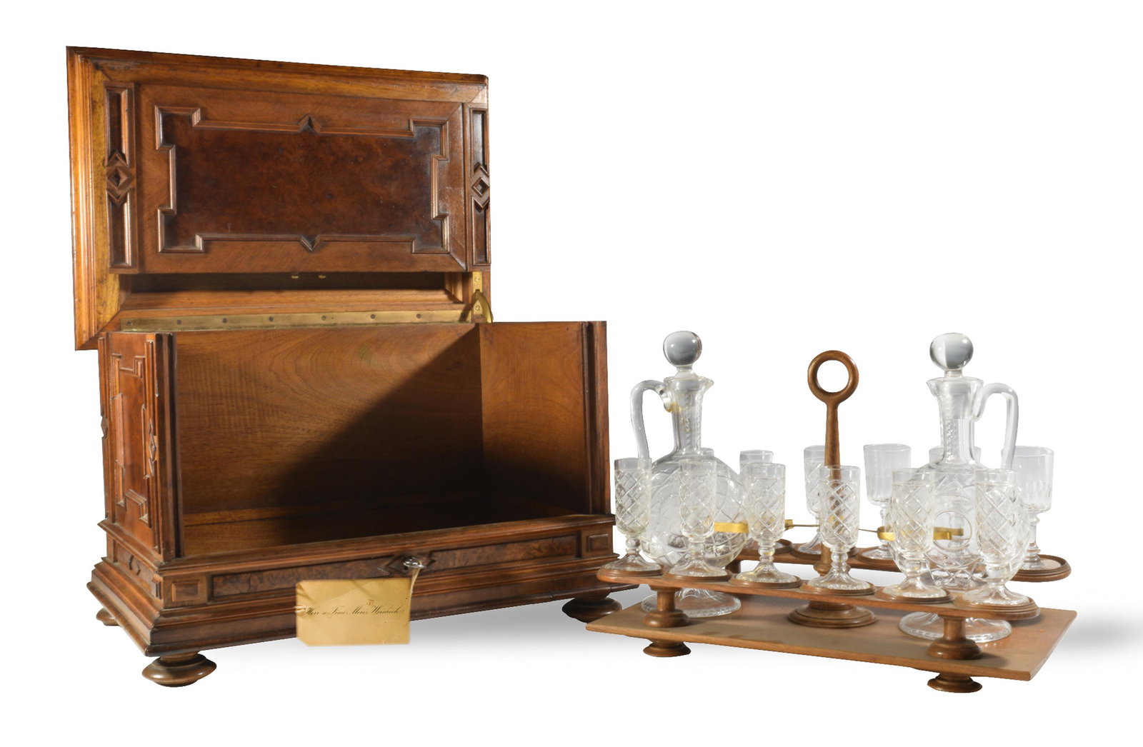 Walnut Aesthetic Movement Liqueur Cabinet c. 1870: A walnut aesthetic movement liqueur cabinet dating circa 1870. It comes with a pair of matching decanters, nine original glasses, and three period replacement glasses. Also includes the original key a