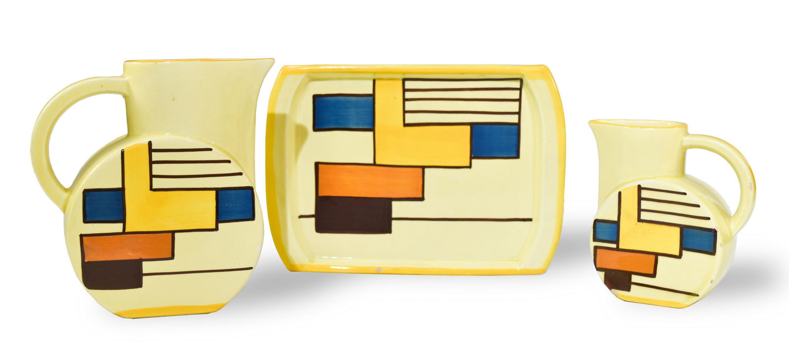 3 Eva Zeisel for Schramberger, Tray and Pitchers: Eva Striker Zeisel (Hungarian, American, 1906-2011) for Schramberger Majolika-Fabrik, Schramberg, Germany, circa 1929-35. Ceramic tray (model 3336, 77), small pitcher (model 3287, 55), and a larger pi