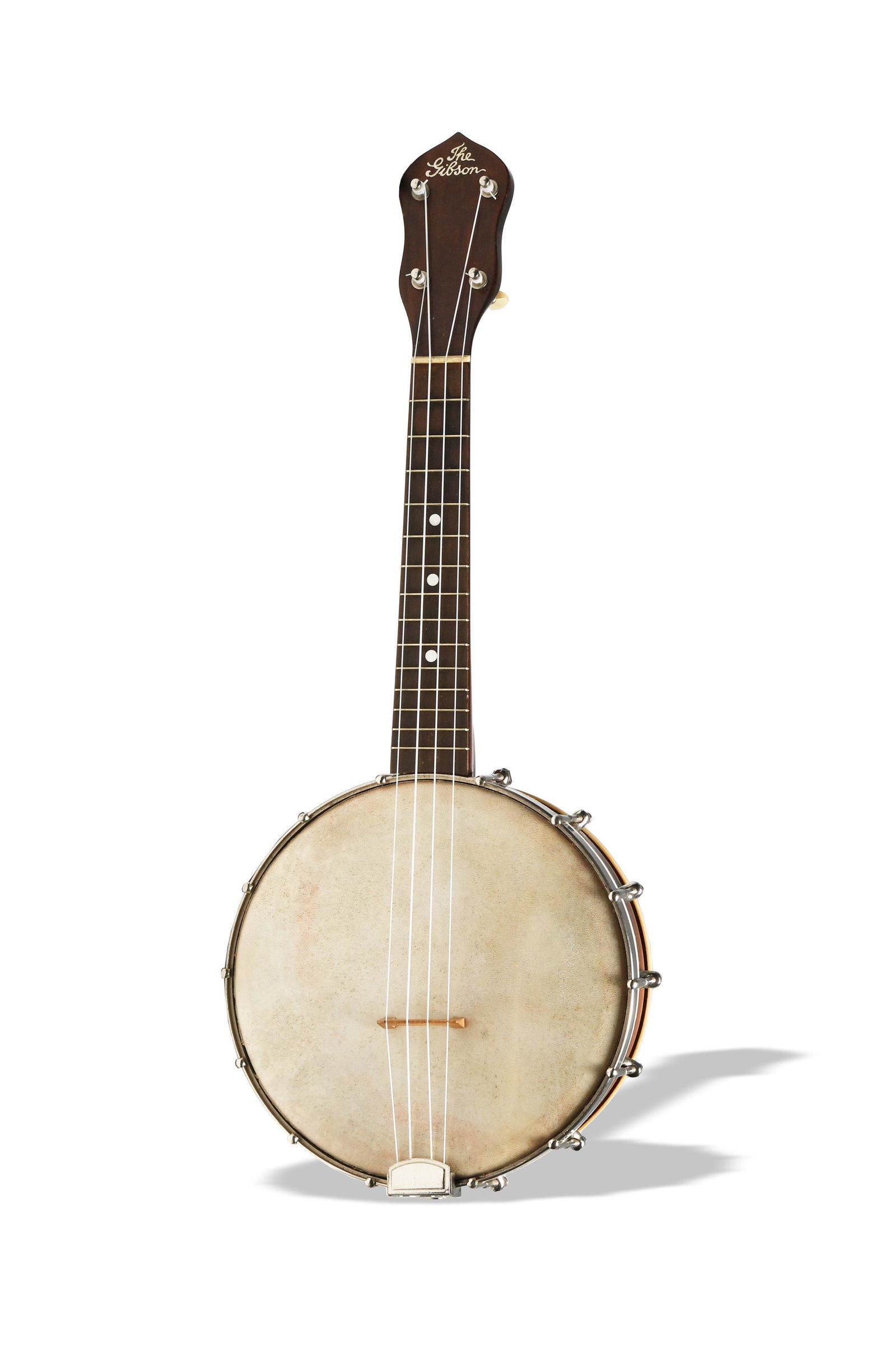 The Gibson UB2 Banjo Ukulele: The UB2 has an 8 inch head, 14 silver fret bars, three mother of pearl insets on the neck, skin head, and resonator. Comes with a soft case. Dimensions: 21 1/2 inches long X 8 3/8 inches wide; 54.61 c
