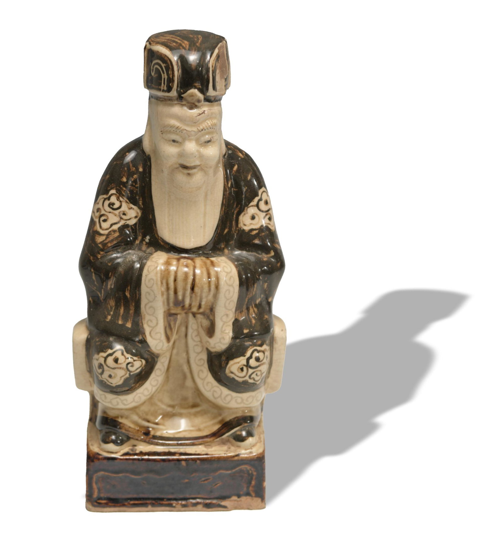 Chinese Ceramic Statue, Ming: A Chinese ceramic statue of a seated male figure dating from the Ming dynasty. Dimensions are: 12 inches tall X 5 1/2 inches wide, 30.5 cm X 14 cm. All measurements are approximate. Condition: There a