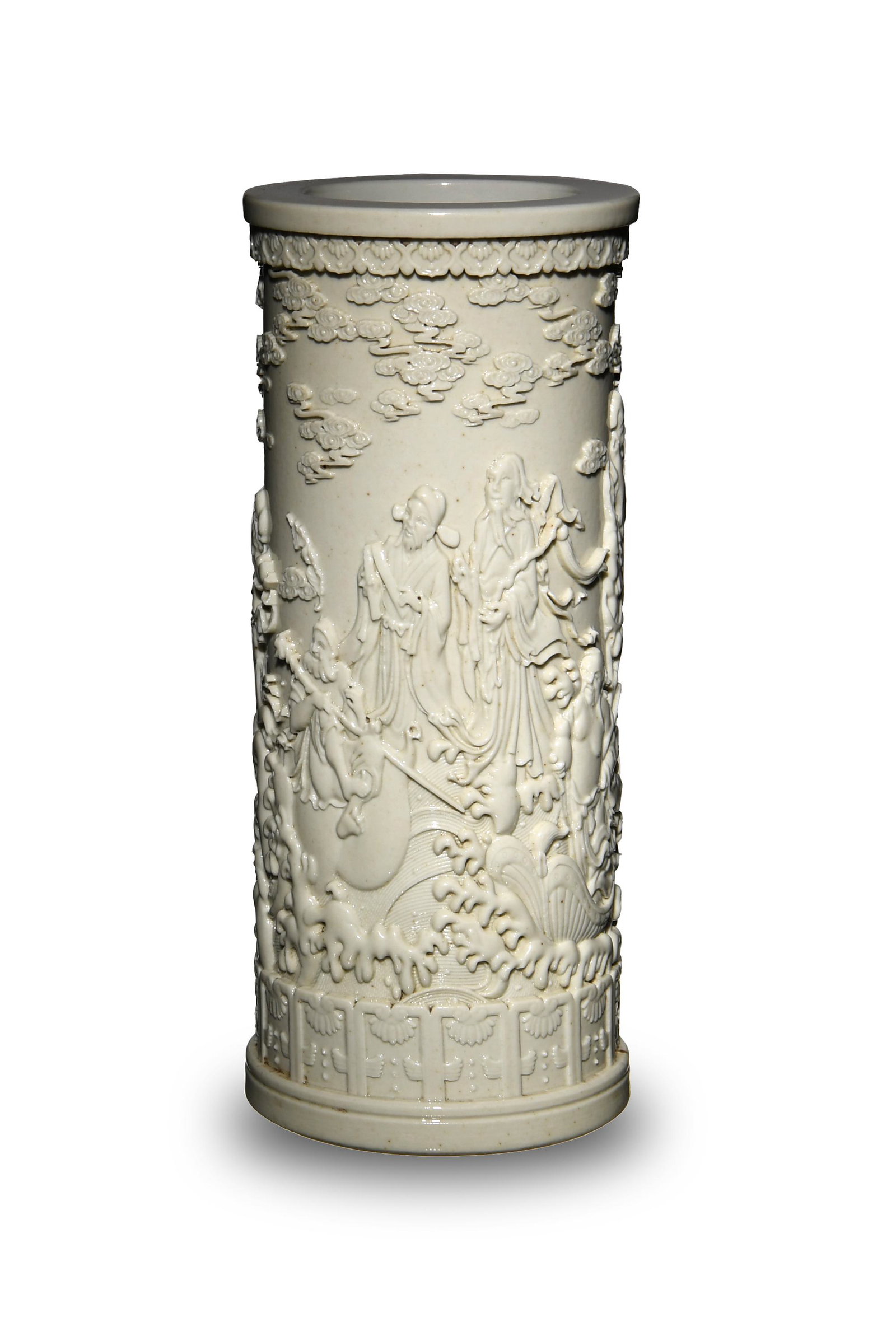 Carved Blanc de Chine Brush Holder: Depicting the 8 Immortals. Brush holder is carved in deep relief with decorative borders on the top and bottom. Brush holder has a six character seal on the bottom. Dimensions: 6 3/4 inches tall X 2 3