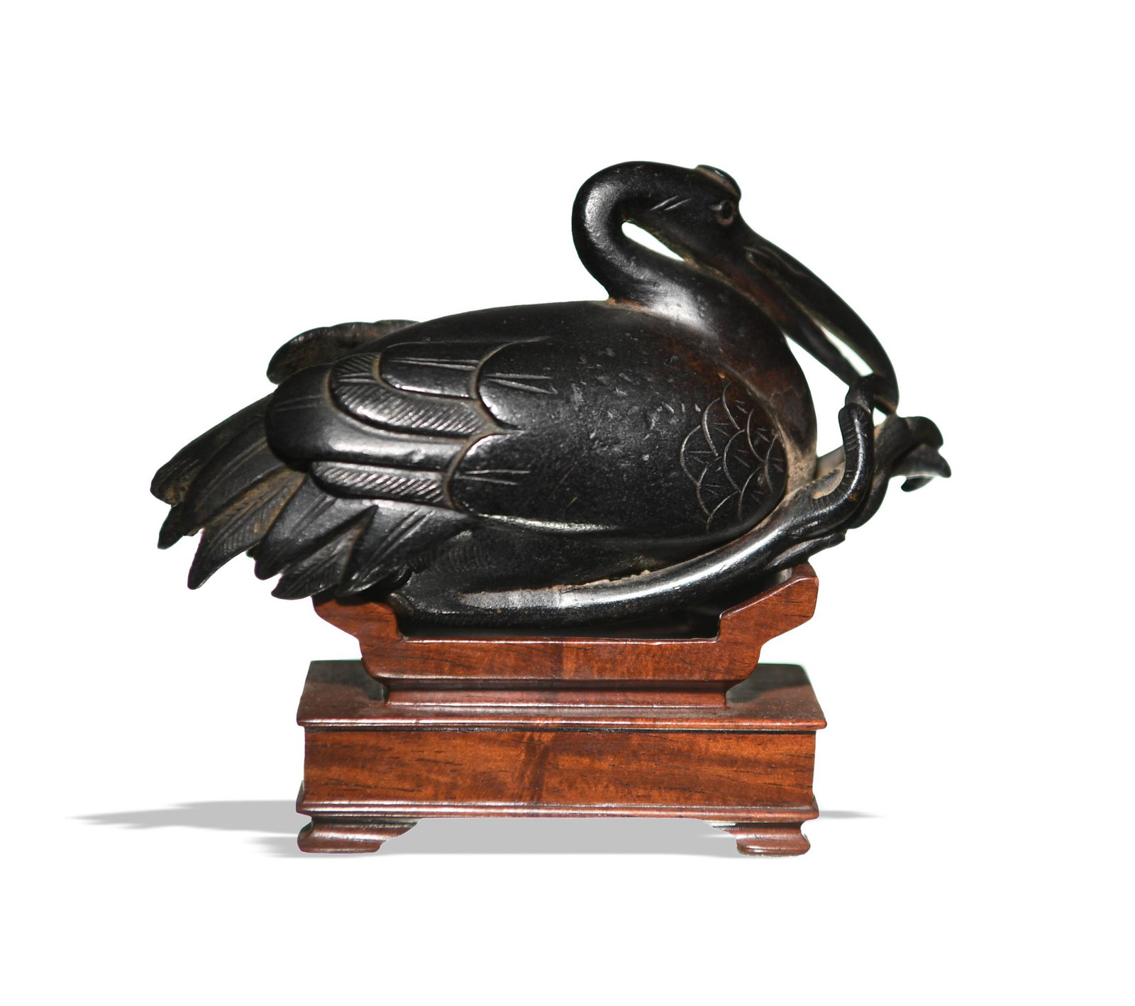 Chinese Bronze Crane Paperweight with Stand, Ming: A Chinese bronze paper weight of a crane dating from the Ming dynasty with a hardwood stand. Dimensions are: 2 1/4 inches tall X 4 inches wide, 5.7 cm X 10.2 cm. Weight: 264.4 grams. All measurements 