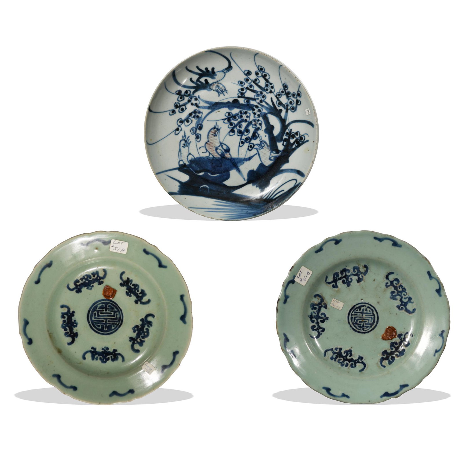 Three Chinese Blue and White Plates, 18th Century: A group of three Chinese blue and white plates dating from the 18th century. The group includes: a pair of celadon-ground plates with five bats surrounding a Shou medallion and a 4-character mark on t