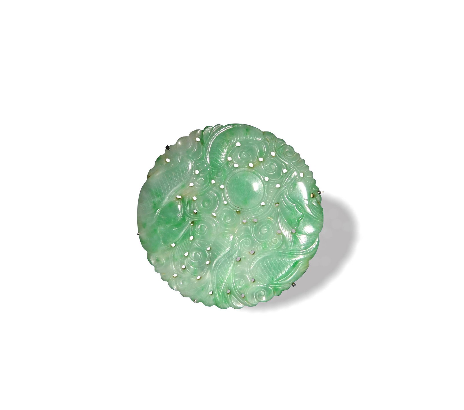 Chinese Jadeite Round Pierced Plaque, 19th Century: A Chinese circular jadeite plaque dating from the 19th century. The plaque is pierced with a dragon. Dimensions are: 1 7/8 inches in diameter, 4.76 cm. All measurements are approximate. Condition: It 
