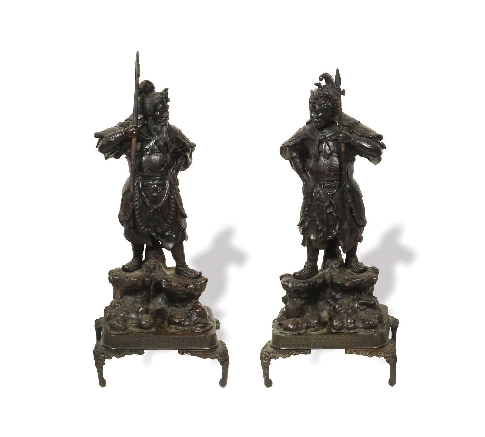Pair of Japanese Bronze Guardian Gods, Meiji: A pair of Japanese bronze guardian god statues dating from the Meiji period. Each comes with a bronze stand, and each holds a long weapon which can be removed from their hands. The gods wear armor inc