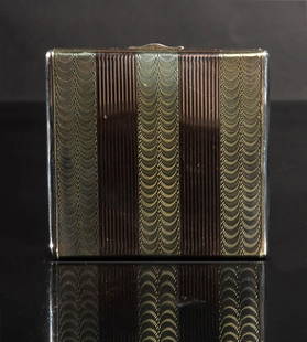 14K Gold and Sterling Art Deco Compact, Cartier: A Cartier 14K gold and sterling silver art deco compact with the original mirror and cloth insert. The compact is hallmarked on the edge; sterling, 14K and Cartier. Total Weight: 89.9 grams (2.89 ozt)