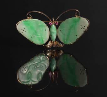 14K Gold and Jade Butterfly Brooch, Sapphire Eyes: 14K yellow gold brooch in the form of a butterfly, wings are carved and pierced jadeite plaques with a jadeite body. Eyes are pink sapphires. Dimensions are: Weight, 9.5 grams (.31 ozt.). 1 1/4