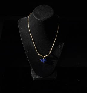 14K Gold and Lapis Butterfly Necklace: A 14K gold and lapis necklace. The lapis is shaped to look like a butterfly. Dimensions are: 9 1/2 inches long, 24.13 cm. All measurements are approximate. Condition: Natural inclusions to the