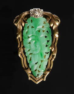 14K Gold Jadeite and Diamond Art Deco Brooch: 14K gold Art Deco brooch with carved and pierced jadeite plaque with diamond shield at top consisting of seven European cut diamonds totaling approximately .14 ctw. Back hinged sweater catch and pin