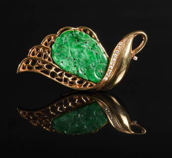 18K Gold, Diamond and Jadeite Brooch: An 18K gold brooch with diamonds and a carved jadeite plaque. The brooch is set with 11 diamonds totaling approximately .22 ctw. Total Weight: 15.5 grams (.5 ozt). Dimensions are: 2 1/2 inches long