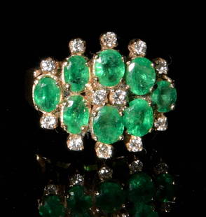 Lady's 14K Gold Emerald and Diamond Ring: Ladies 14K yellow gold ring with 8 prong set oval cut emeralds of about .20 carats to .25 carats totaling approximately 1.8 ctw and 12 prong set diamonds of about .020 carats each totaling about .24