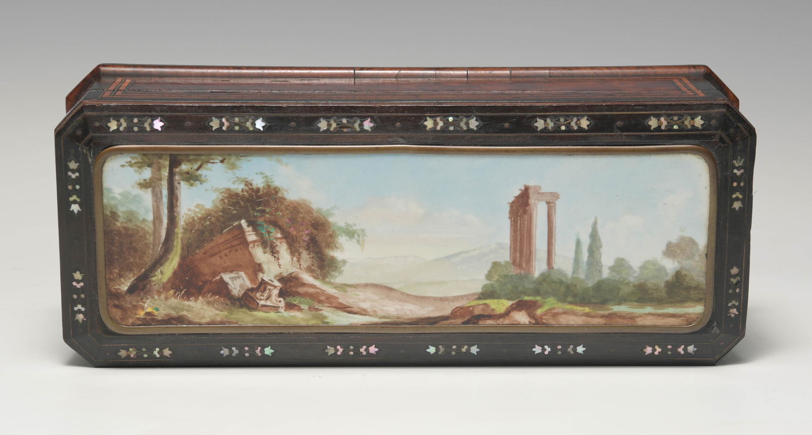 Burl Wood Grand Tour Casket with Porcelain Plaque: A burl wood Grand Tour casket with a painted porcelain plaque of Roman ruins. The wood has string inlay to the sides with fruitwood while the lid has mother of pearl inlay and porcelain plaques. The p