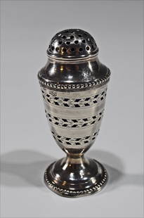 Hester Bateman Georgian Pepper Pot, 1787: A Georgian pepper pot with a London hallmark and date marked for 1787. The pepper pot was made by Hester Bateman and comes with a cobalt lining, possibly original to the piece. Dimensions are: 3 1/2