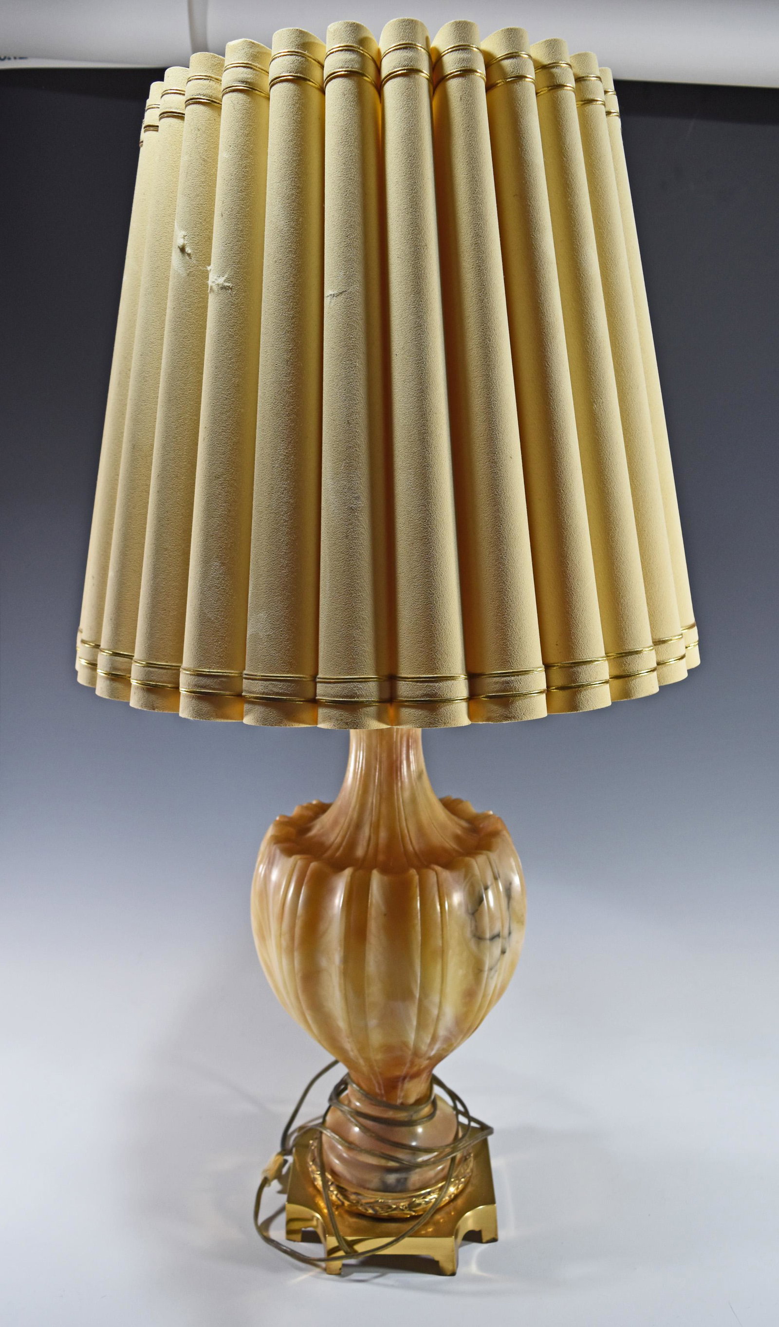 Alabaster Lamp by Marbro: A carved urn form alabaster lamp by Marbro with a lampshade that is likely the original shade. Dimensions are: 34 inches tall X 14 inches wide, 86.36 cm X 35.56 cm. All measurements are approximate. C