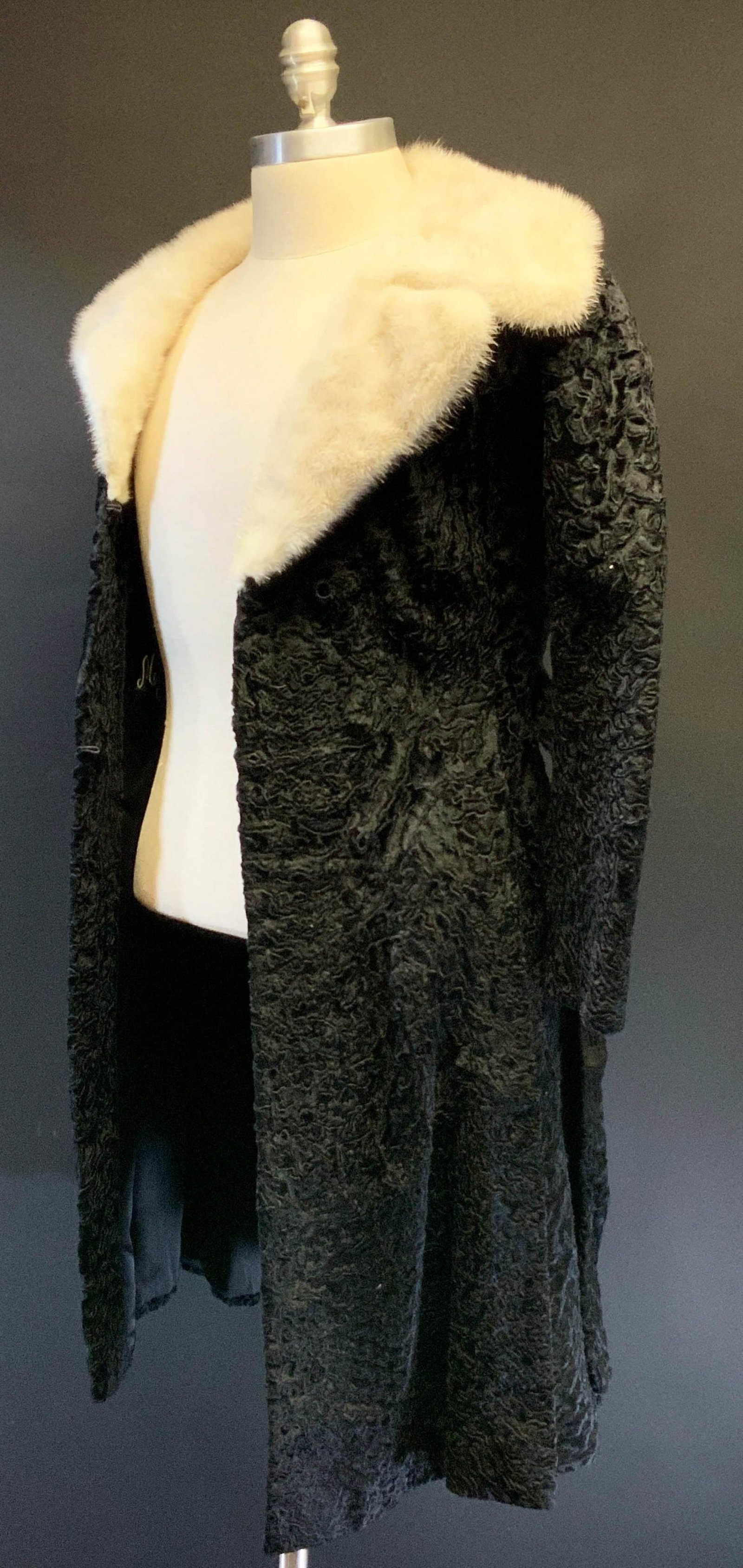 A Shearling and Mink Coat from Rosendorf-Evans: A shearling and mink coat from Rosendorf-Evans. The coat is monogrammed â€˜MGMâ€™ on the inside. Dimensions are: the coat is a size petite. All measurements are approximate. Condition: Age an