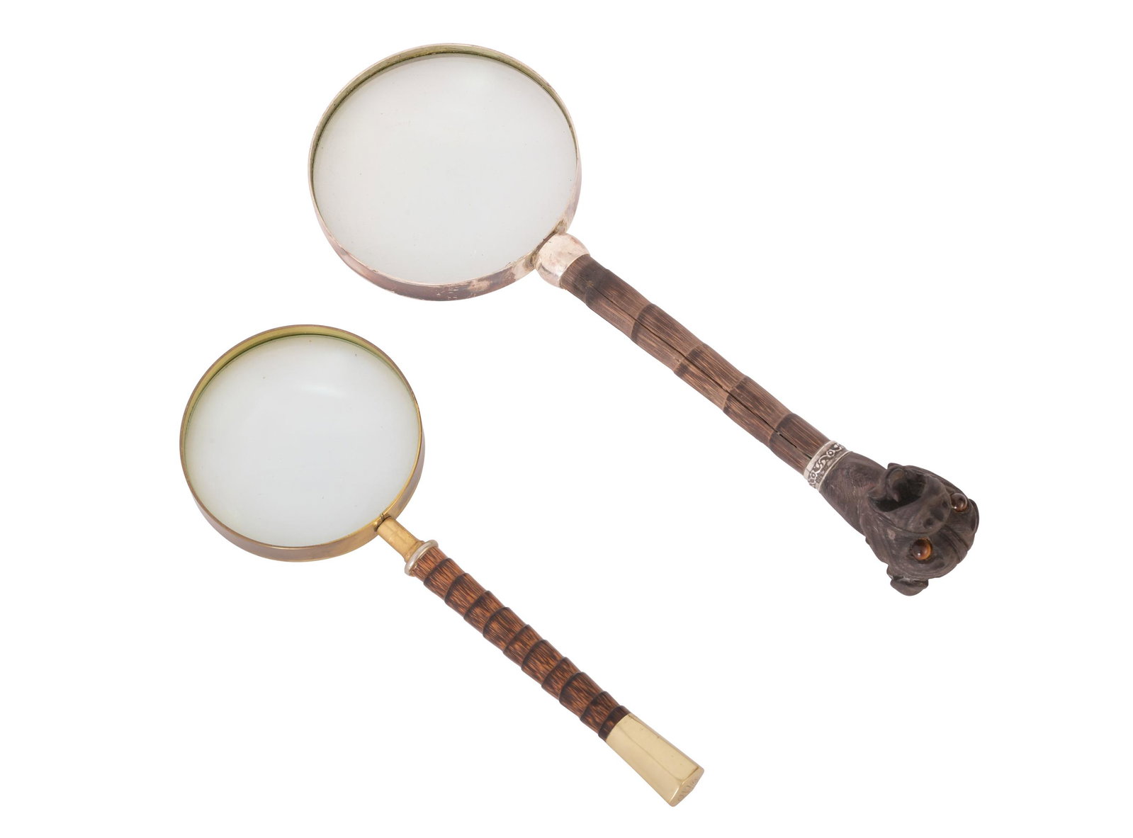2 Carved Magnifying Glasses, Bulldog and 14K Gold: A group of 2 finely carved magnifying glasses. One has a carved bulldog handle with Tiger's Eye for eyes and a sterling collar. The other has a faux bamboo handle with a 14K gold monogrammed cap. Dime