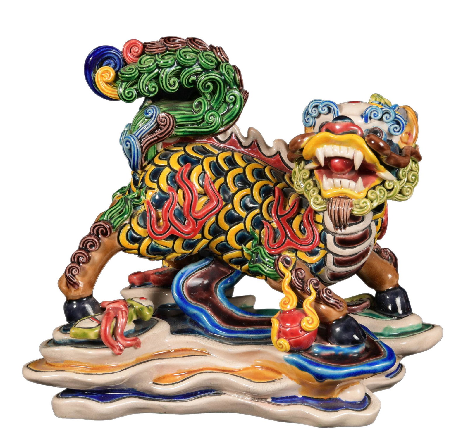 Chinese Sancai Foo Guardian: A Chinese sancai guardian lion porcelain sculpture with the motifs of a flaming pearl, ruyi wand, lucky coins, and a scholar's object by the feet. The bottom is marked. Dimensions are: 7 inches tall X