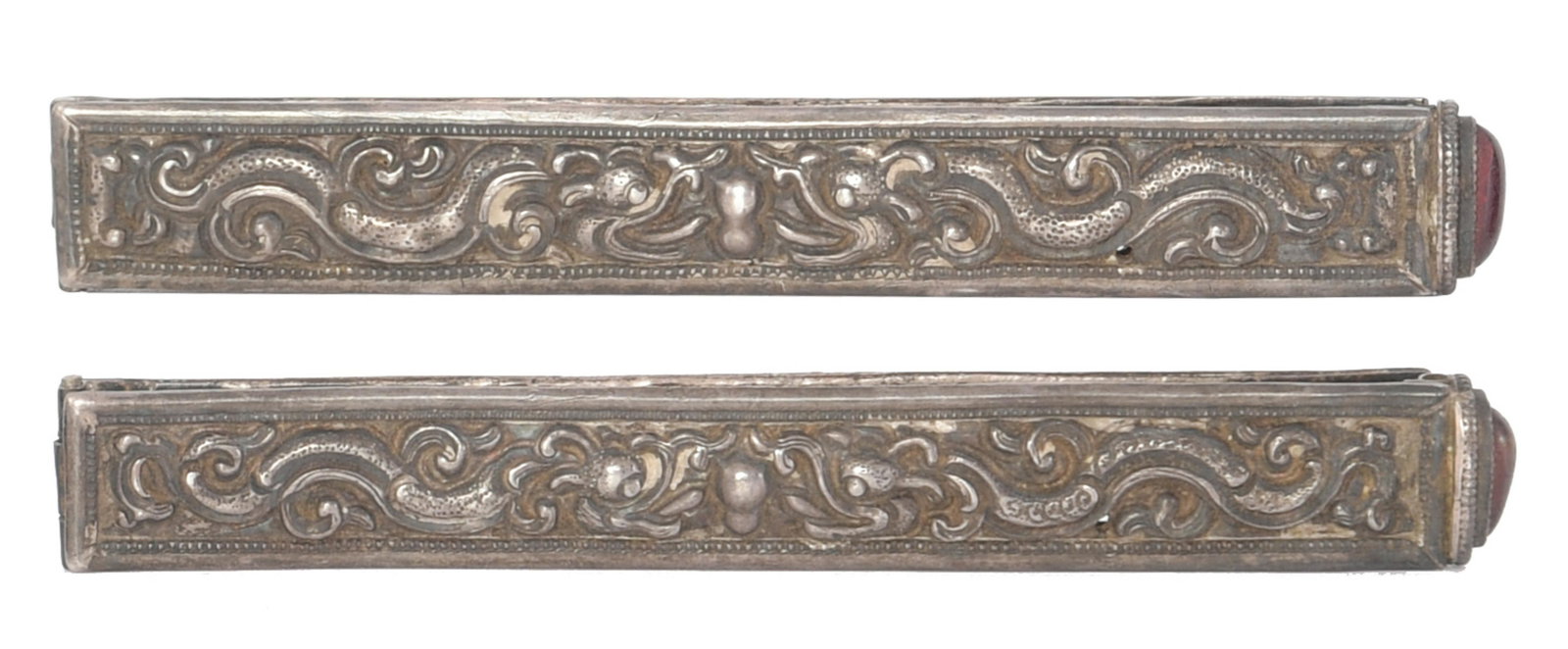 Pair of Mongolian Silver Hair Clips with Amber: A pair of Mongolian silver hair clips with mythical beast designs and amber inland at the tops of each. Dimensions are: 5 inches long, 12.7 cm. Total Weight: 103.5 grams (3.32 ozt). All measurements a