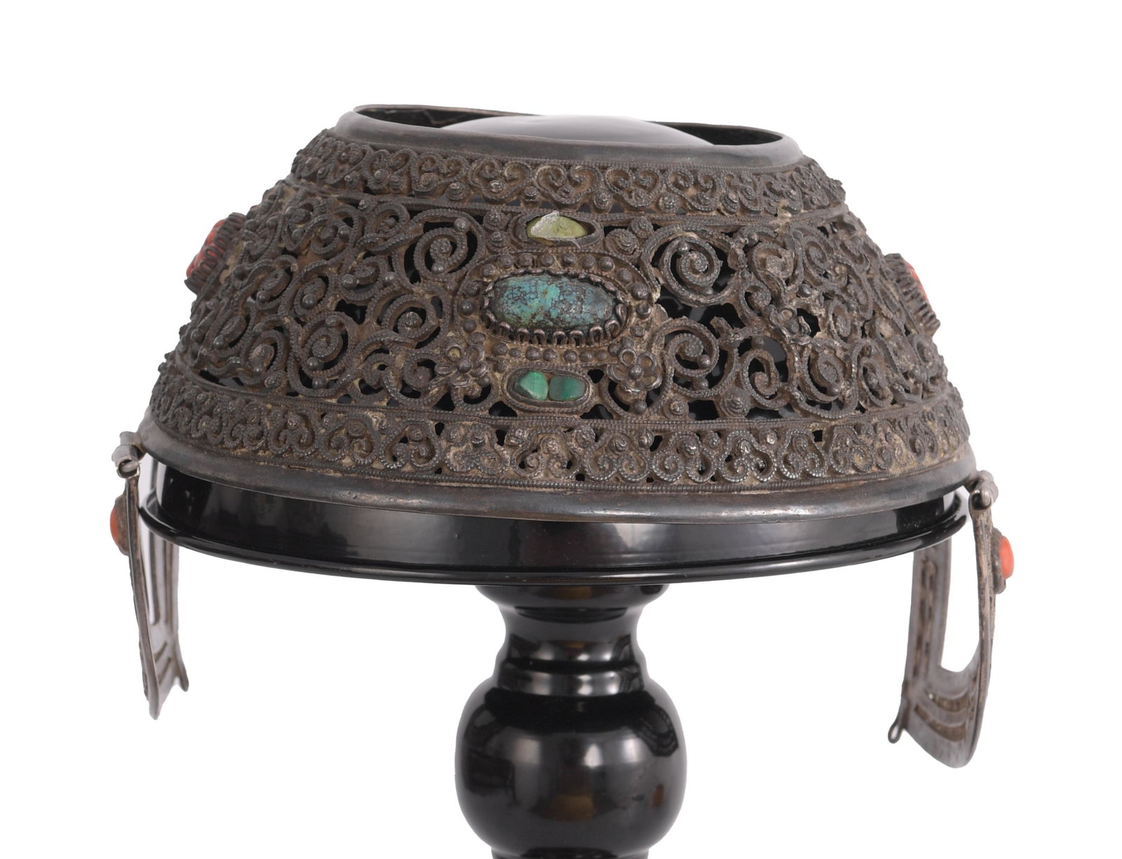 Mongolian Silver, Coral and Turquoise Wedding Cap: A Mongolian Khalkha silver wedding cap with inlaid precious stones including turquoise and coral. The cap is decorated with an elaborate pattern of scrolls with flowers, framed on the top and bottom w