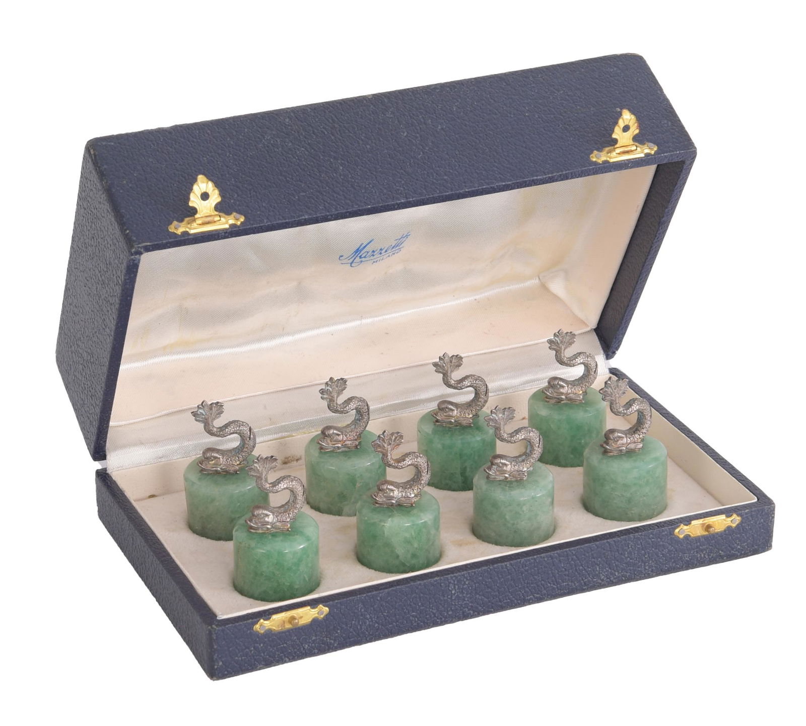 Cased Set of Stone and Dolphin Place Card Holders: A set of eight place card holders coming in an original retailer's box reading "Marretti Milano." The card holders are made of cylindrical green stone bases-- possibly quartz or fluorite-- topped with