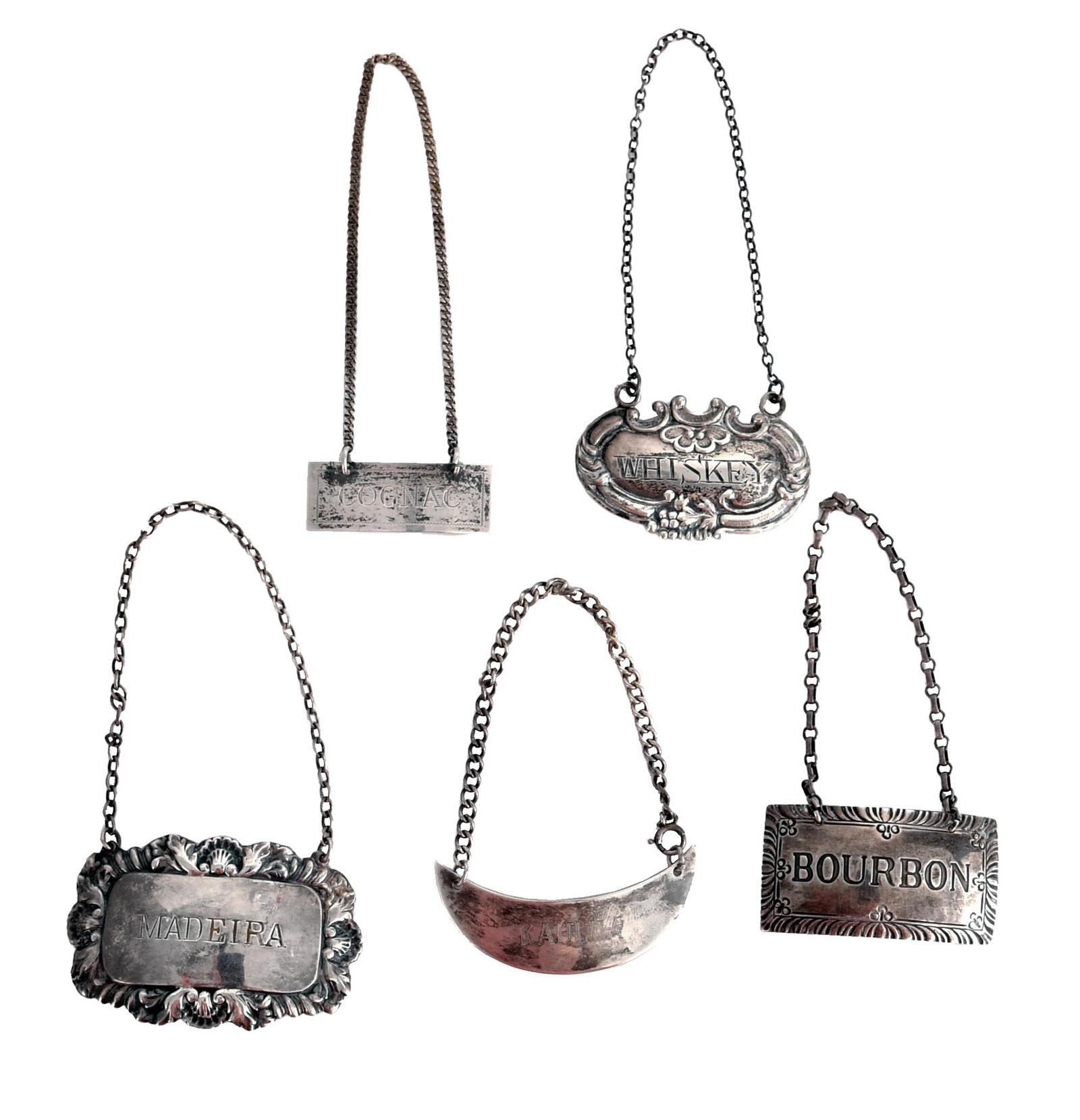 5 Sterling Liquor Bottle Labels, English Etc.: Five sterling silver assorted liquor bottle labels. The lot includes a bourbon label by Williamsburg Restoration, a Kahlua label by R. Blackinton, a 1971 English silver Madeira label by Hampton Utilit