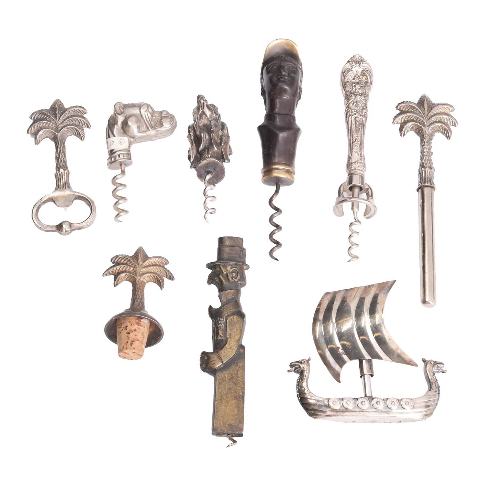 9 Antique and Vintage Figural Corkscrews: A group of 9 antique figural corkscrews including an Old Snifter, a caricature of Andrew John Volstead, a bronze and brass English jockey, a Viking sailing ship, an English bulldog, a spaniel, a three