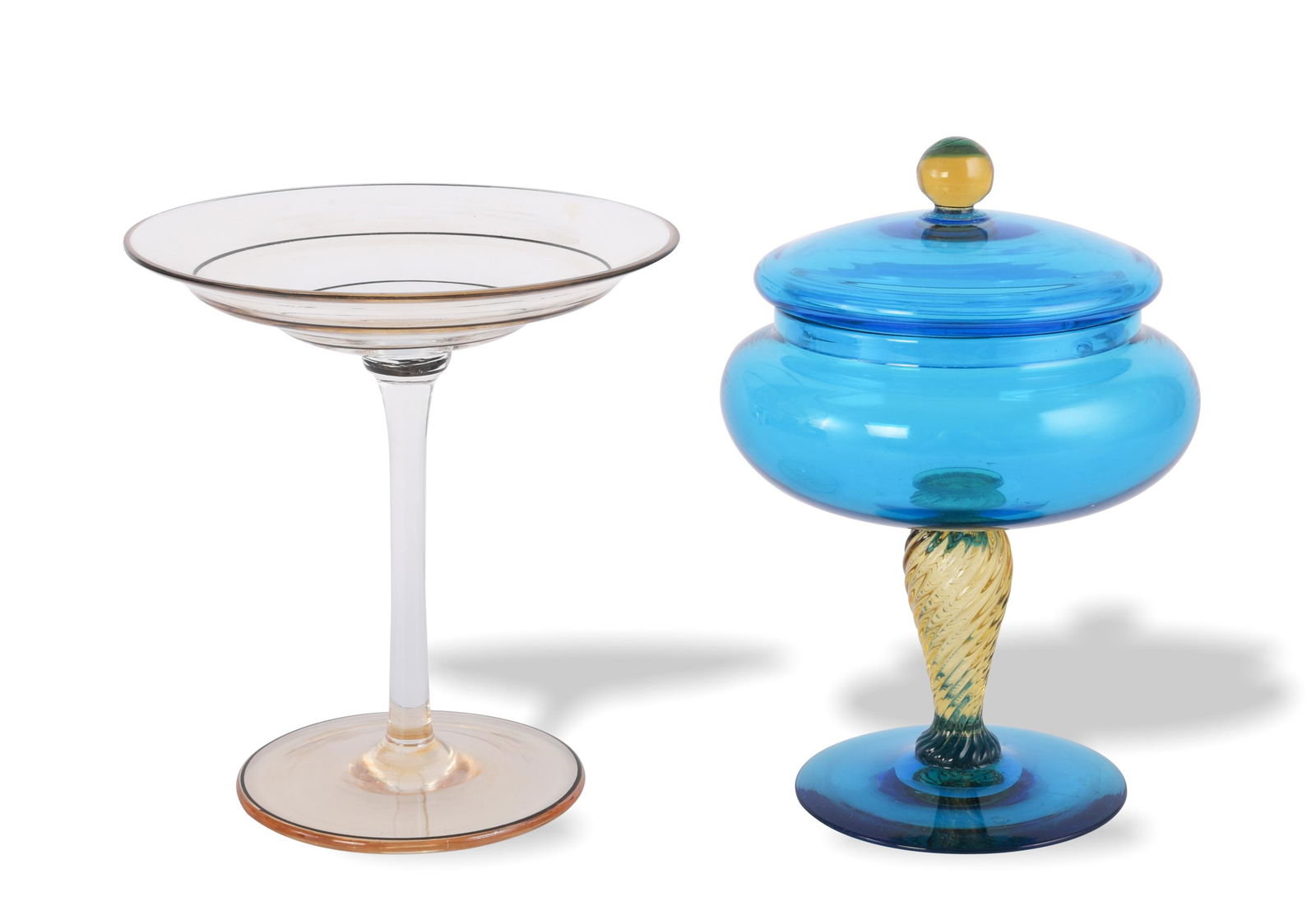 Steuben Glass Covered Vase Shape 5128 & Compote: The lot includes a Steuben hand blown covered vase, shape 5128, designed by Frederick Carder with a fleur de lis mark on the bottom and an unsigned Steuben compote. The vase comes in Celeste blue with