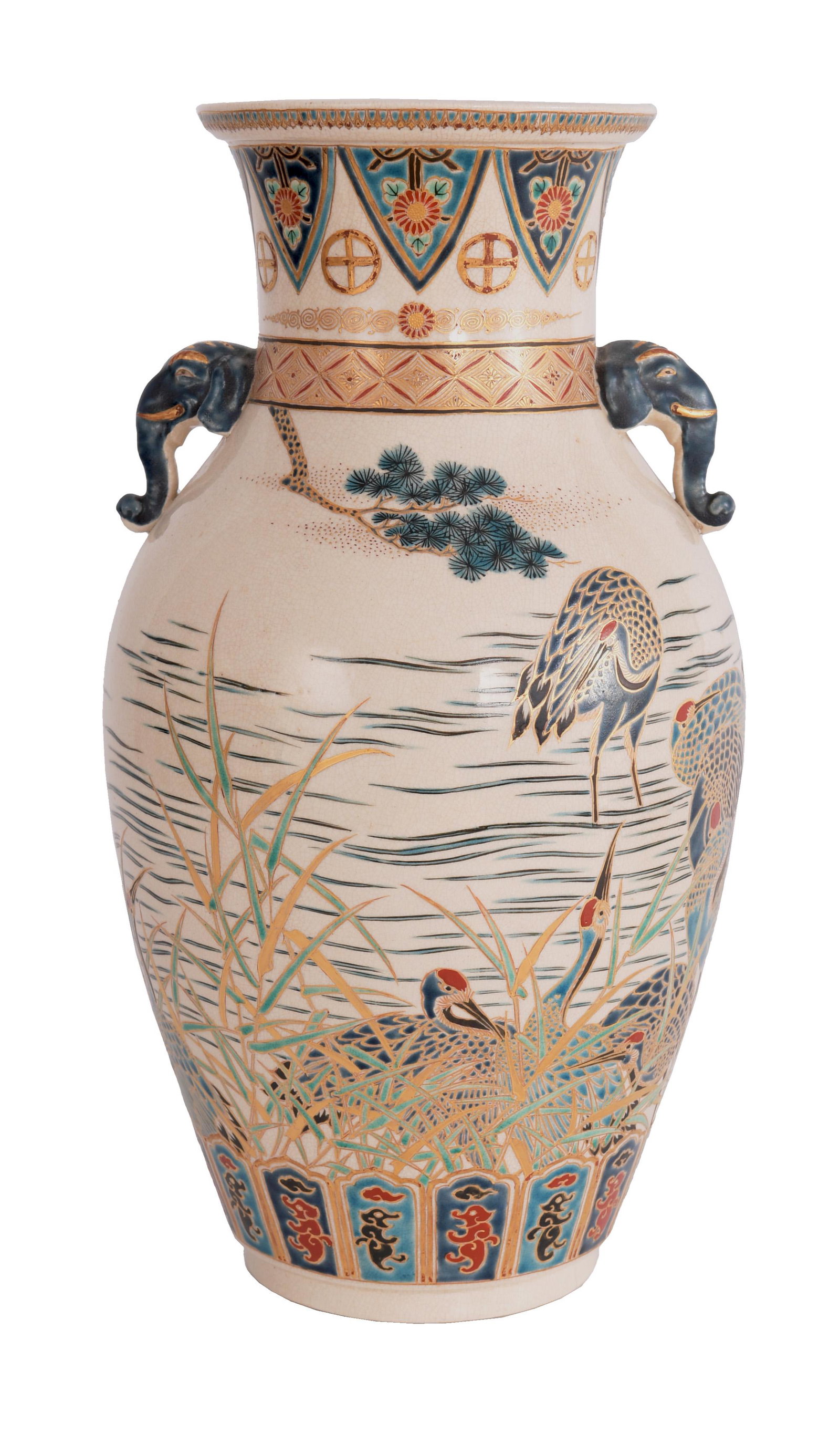 Japanese Gosu Blue Satsuma Vase, Elephant Handles: A Japanese gosu blue satsuma vase with elephant handles that dates to the Meiji period. The vase depicts a water scene with cranes among reeds in a river. The bottom of the vase features a stylized bo