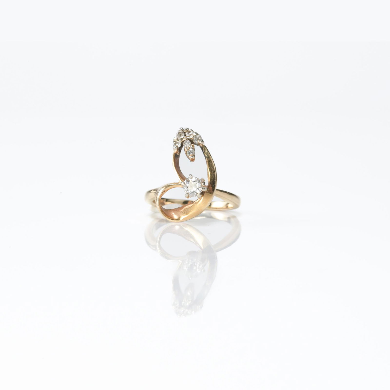 14K yellow gold ring with a .20 carat stone with a group of 6 smaller stones all totaling (1 of 8)