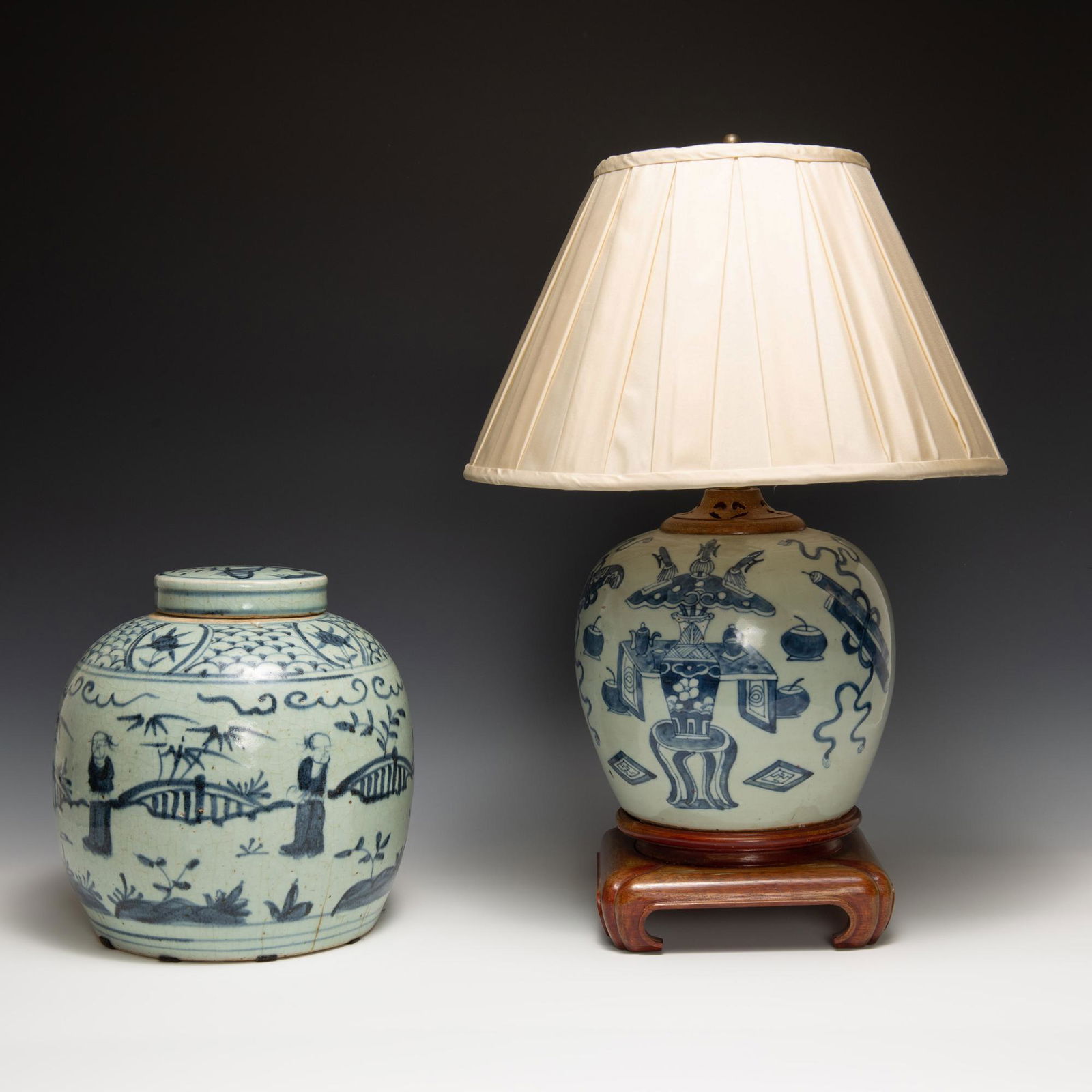 Two Chinese blue and white celadon ground jars, one with a lid and one converted into a lamp.: Two Chinese blue and white celadon ground jars, one with a lid and one converted into a lamp. Dimensions are: the ginger jar measures 10 inches tall X 9 inches wide, 25.40 cm X 22.86 cm. All measureme