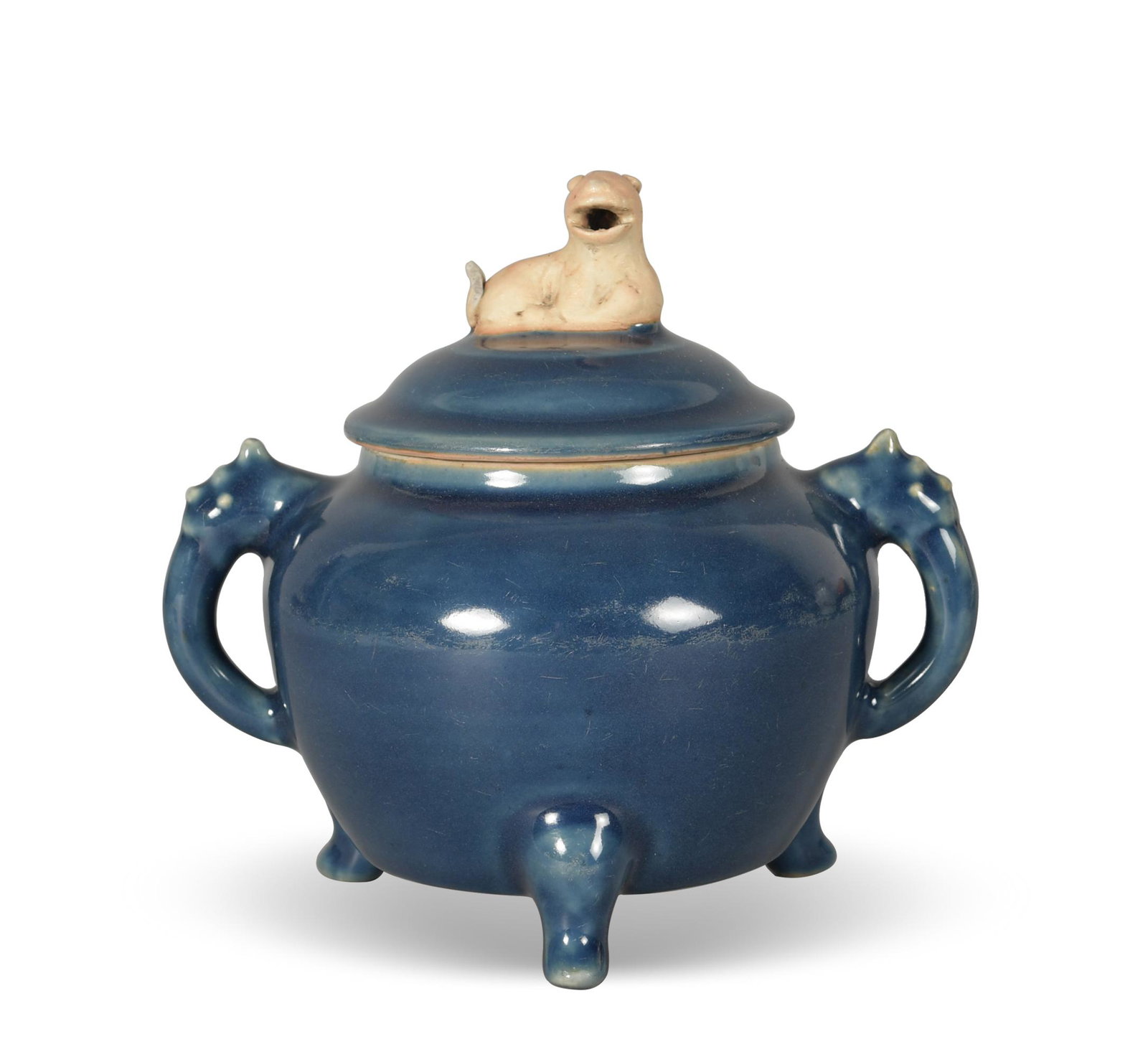 A Chinese sacrificial blue porcelain censer dating from the Ming dynasty. The tripod censer has two: A Chinese sacrificial blue porcelain censer dating from the Ming dynasty. The tripod censer has two beast-form handles, and its lid has a beast-form finial. Dimensions are: 6 1/2 inches tall X 7 inche