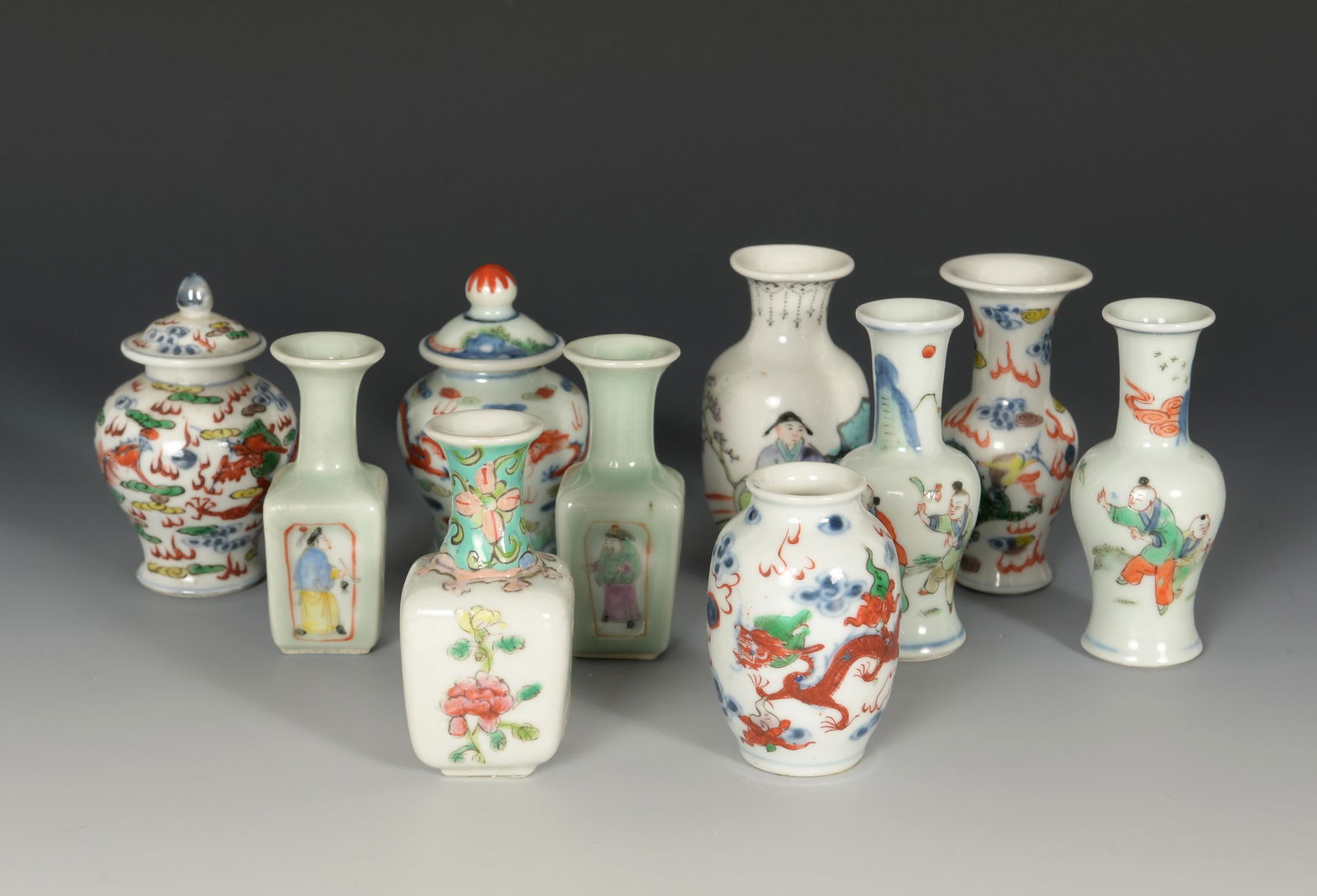Group of 10 Chinese Porcelains, 19th - Early 20th Century: A group of 10 Chinese miniature porcelains dating from the 19th to early 20th century. Included in this lot are: a pair of lidded jars, a pair of celadon ground square vases, a pair of vases featuring