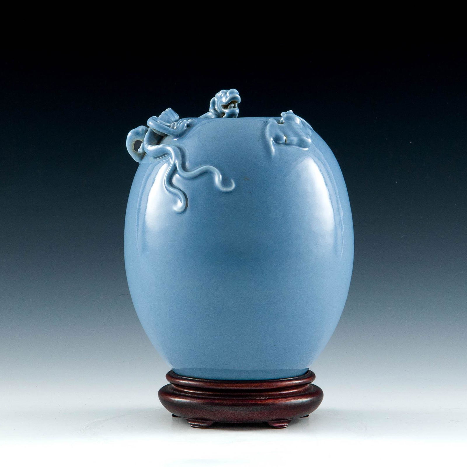 A Chinese celadon vase, Republic period: A Chinese celadon vase Republic period With six-character mark to underside; sold with associated wooden base. H: 7 3/4, Dia: 6 in. H: 19.69, Dia: 15.24 cm. All measurments are approximate. Provenance