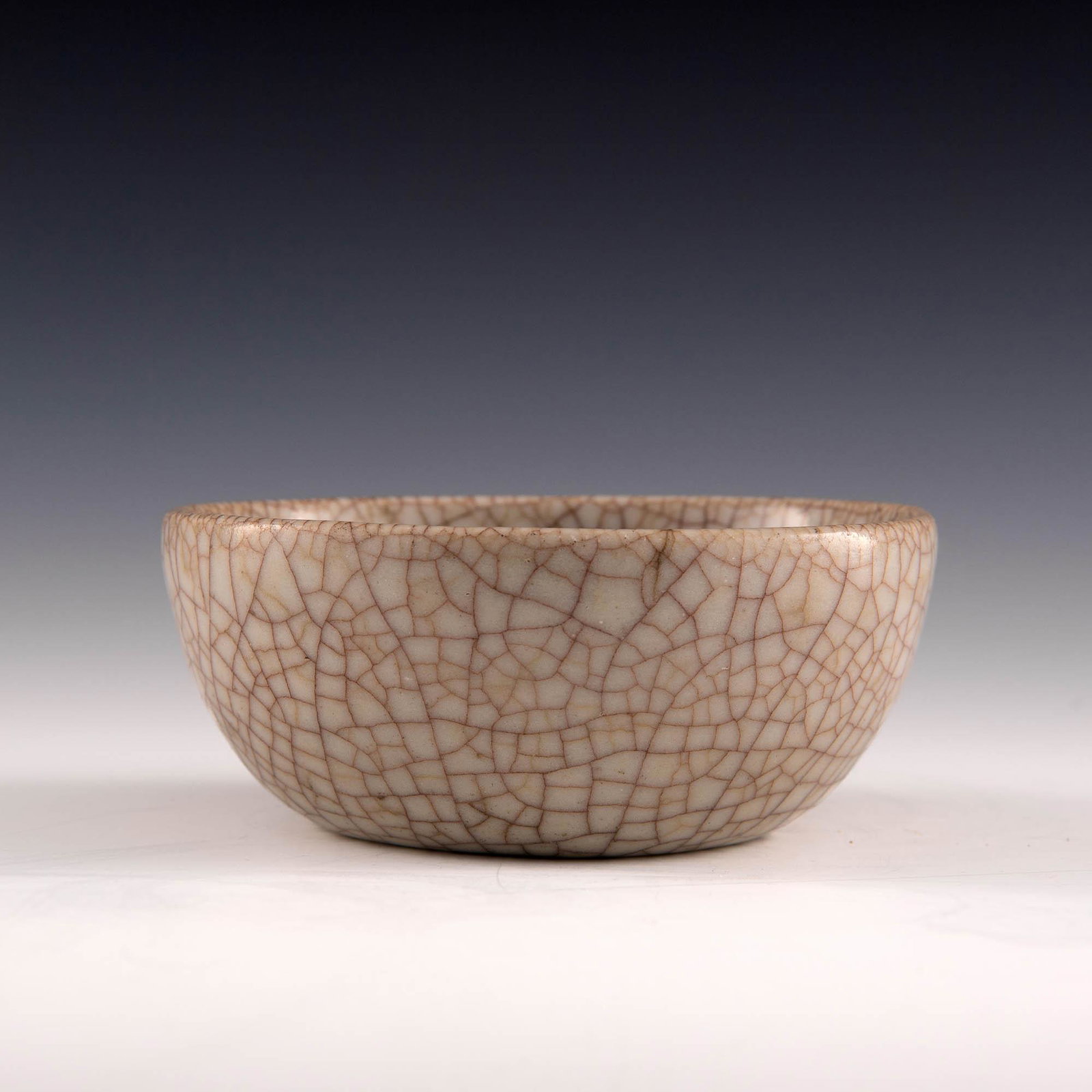 A Chinese ge-glazed bowl, 18th century: A Chinese ge-glazed bowl 18th century H: 2, Dia: 5 in. H: 5.08, Dia: 12.70 cm. All measurments are approximate. Provenance: Mr. Wong, Honolulu, Hawaii. Acquired in Hong Kong in the 1980s. Condition: O