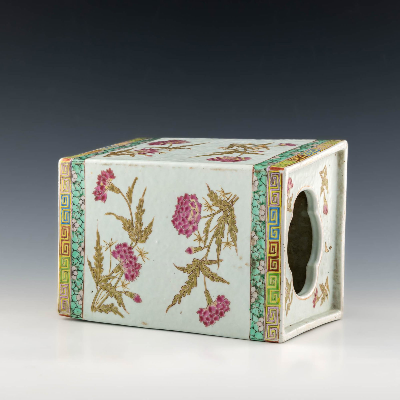 A Chinese famille rose porcelain pillow, late 19th century: A Chinese famille rose porcelain pillow late 19th century H: 9 1/2, W: 7, D: 6 in. H: 24.13, W: 17.78, D: 15.24 cm. All measurments are approximate. Provenance: Estate, New York, New York. Condition: 