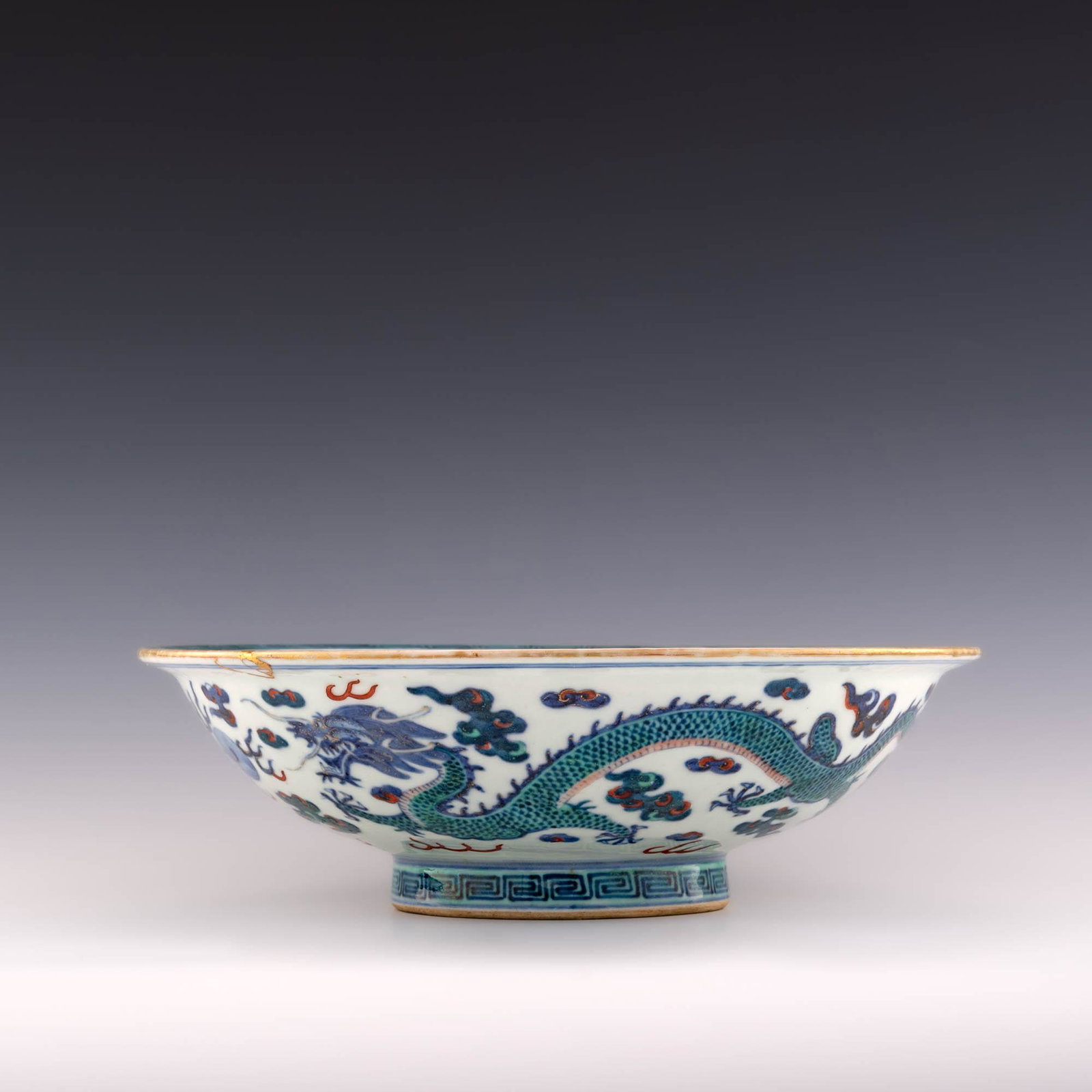 A Chinese doucai dragon bowl, Daoguang period: A Chinese doucai dragon bowl Daoguang period With a six-character Daoguang mark to the underside; the lid with peach financial and a four-character mark. H: 3, Dia: 10 in. H: 7.6, Dia: 25.4 cm. All me
