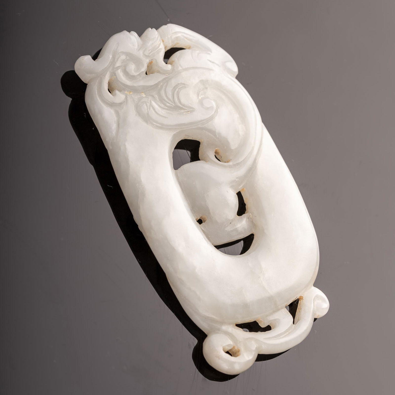 A Chinese white jade bi carved with a chilong, 18th/19th century (1 of 2)