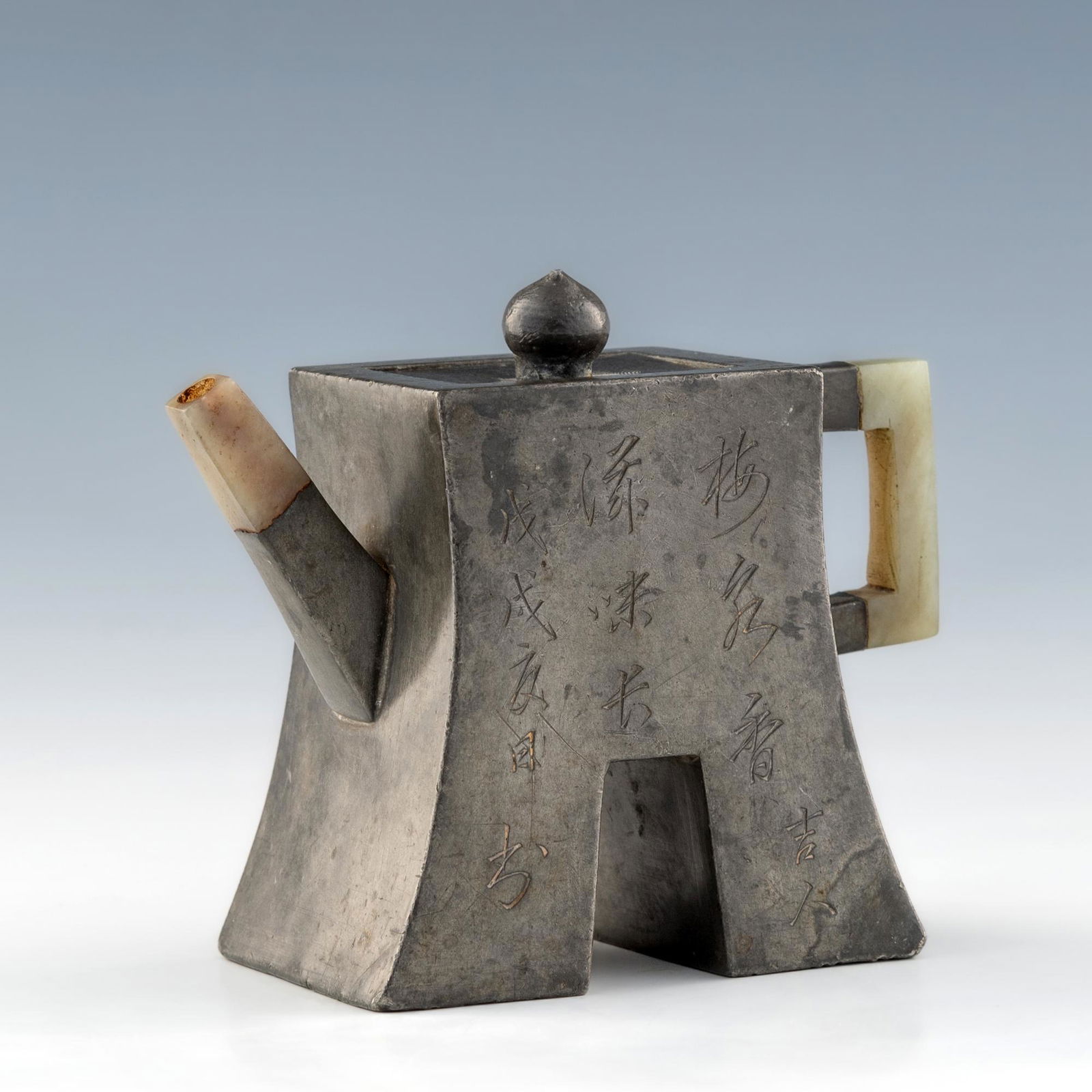 A Chinese pewter encased Yixing Zisha teapot with jade spout and handle
