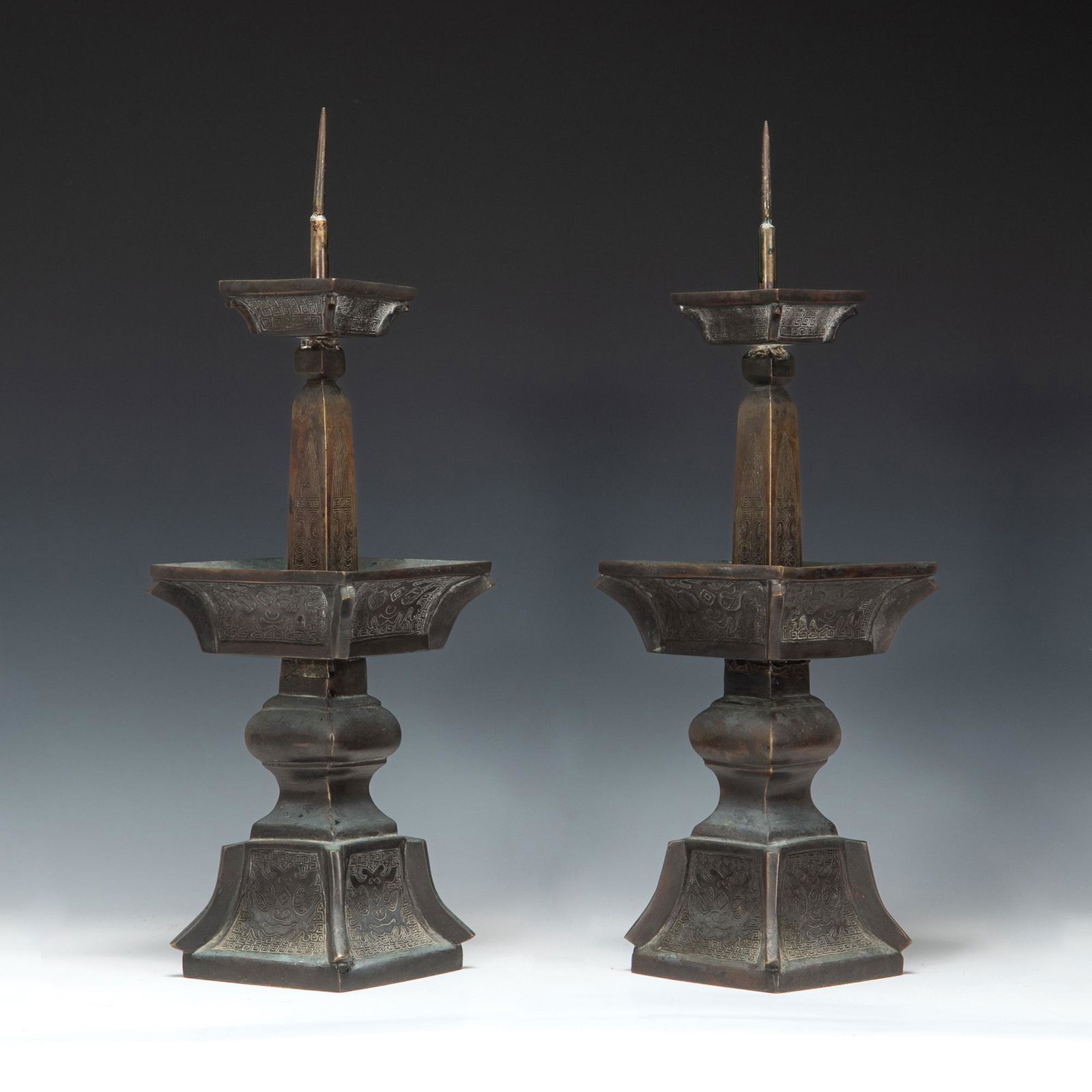 A pair of Chinese bronze candle sticks, 18th/19th century (1 of 7)