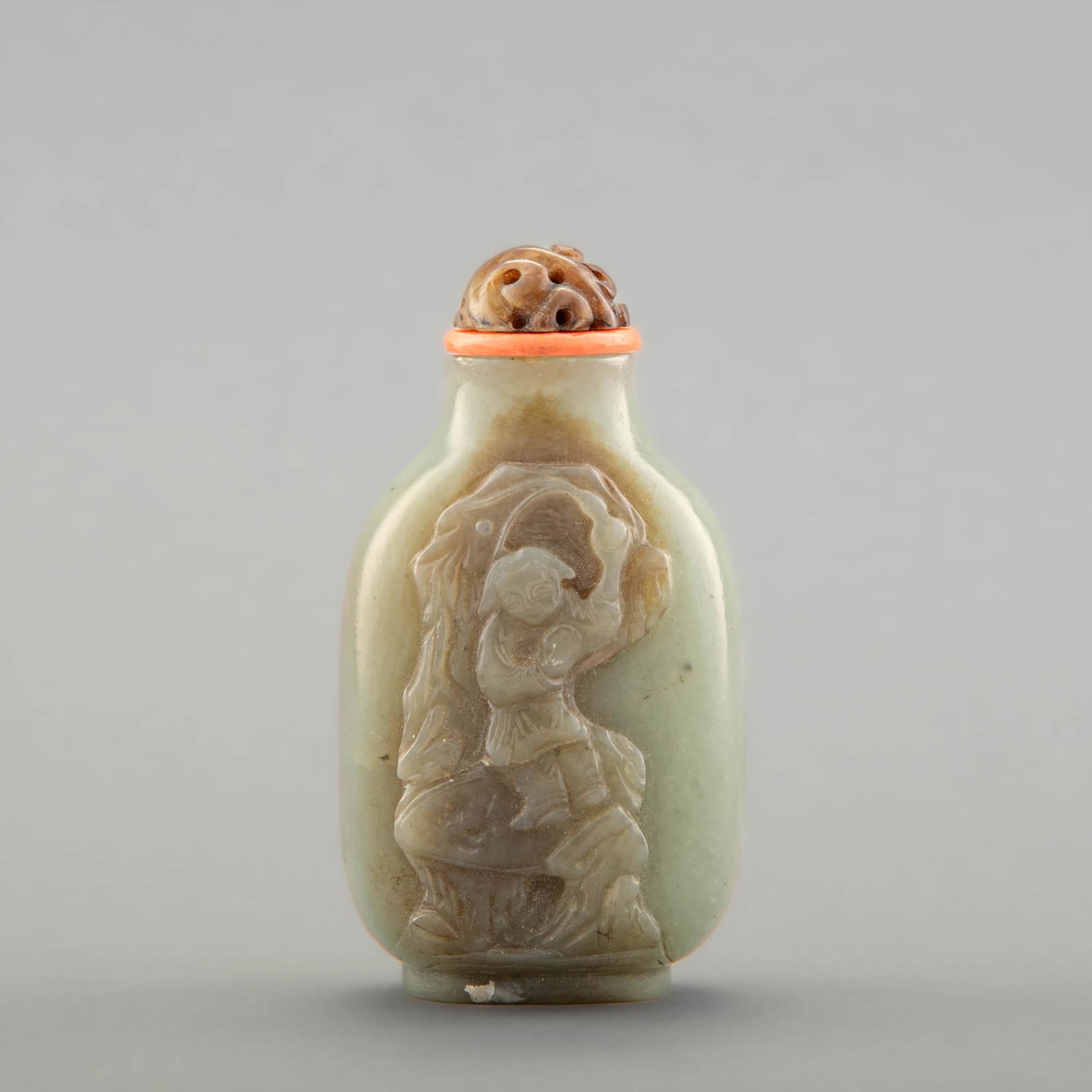 A Chinese carved jade snuff bottle, 18th century: A Chinese carved jade snuff bottle 18th century Sold with associated stopper. Marked "34057-95" to underside. H: 3 1/4 in. (H: 8.26 cm.) Provenance: From the collection of Victor Topper. Private colle