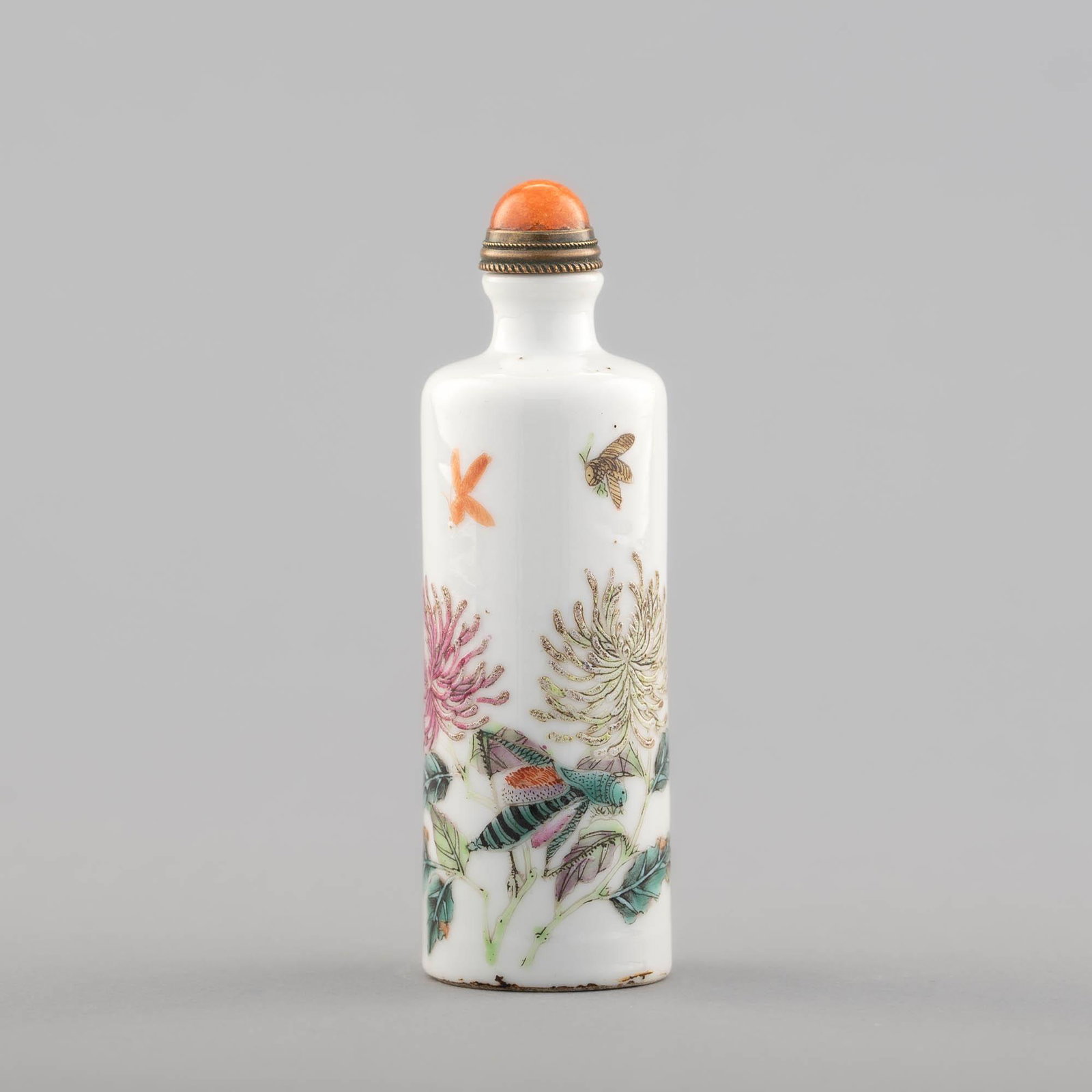 A Chinese famille rose snuff bottle, 19th century: A Chinese famille rose snuff bottle 19th century With chrysanthemums to the body; sold with associated stopper. H: 3 7/8 in. (H: 9.84 cm.) Provenance: Private collection, Cleveland, Ohio. The items in