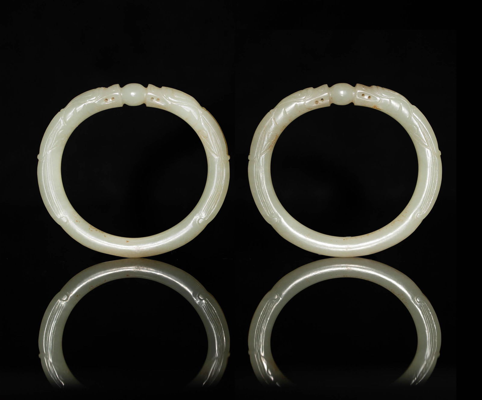 A pair of Chinese jade dragon bangles, 18th century or earlier (1 of 3)