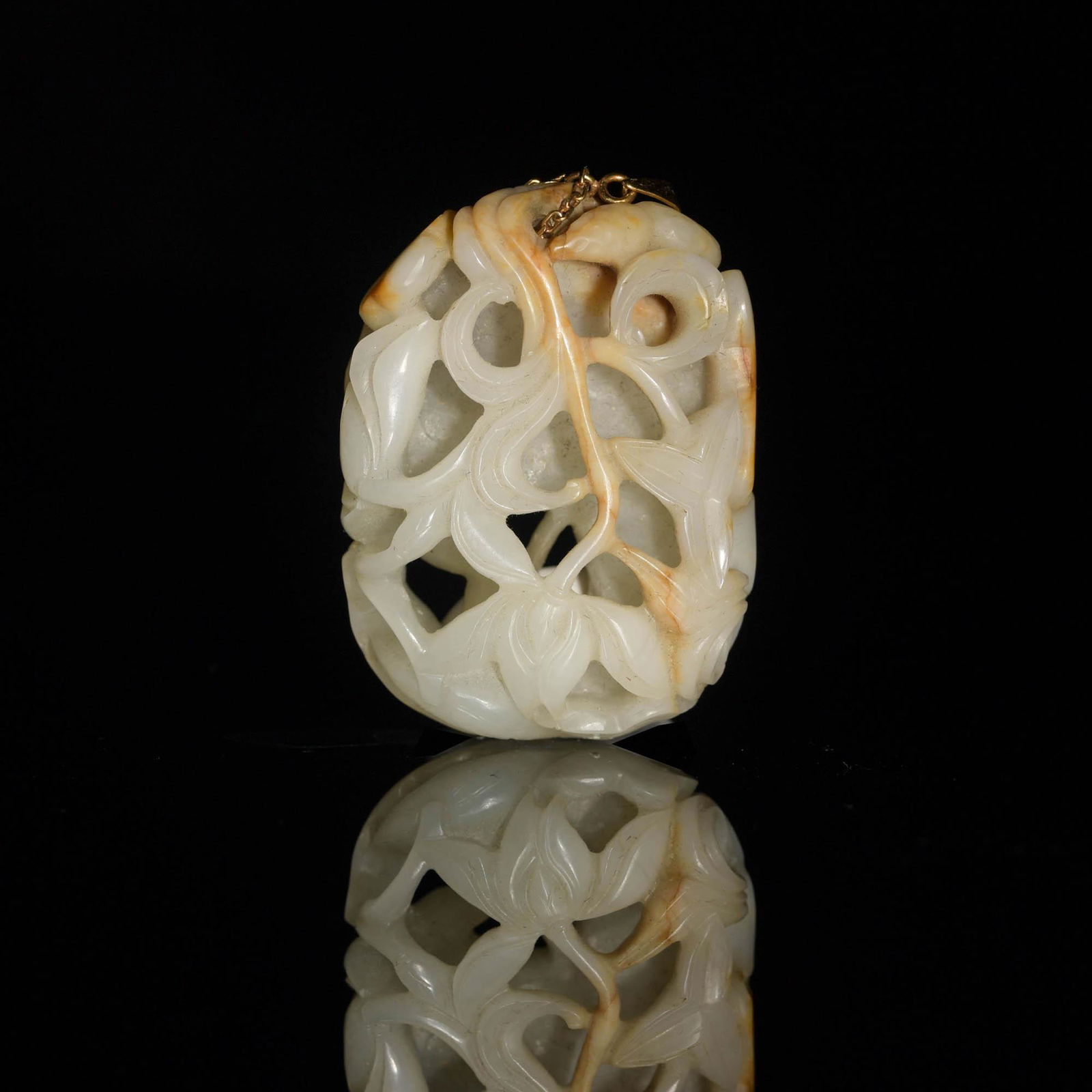 A Chinese, Hetian jade toggle carved with a lotus, 18th/19th century (1 of 7)