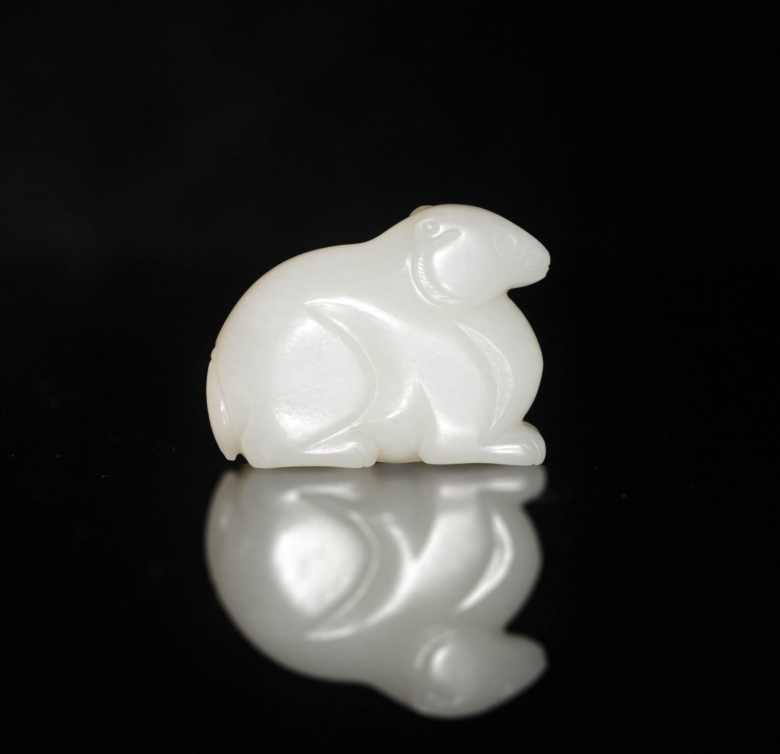 A Chinese white jade beast, Ming dynasty or earlier: A Chinese white jade beast Ming dynasty or earlier H: 2, W: 1 1/2 in. (H: 5.08, W: 3.81 cm.) Provenance: Mr. Williams, Texas. Mr. Williams has more than 50 years of collecting experience in Buddhist s